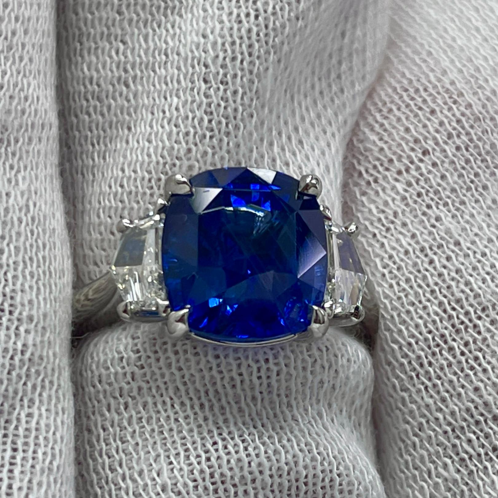 This is a LIVELY sapphire with a very deep color, mounted in an elegant 18K white gold and diamond ring with 0.38Ct of brilliant white diamonds. Suitable for any occasion!
