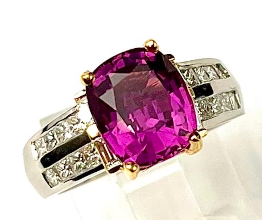 This is an absolutely gorgeous Sapphire with a very rich, vivid and clear Purple Pink color.  The cutting on this gemstone is superb making it appear larger than the carat weight indicates. The ring itself is simple and elegant, allowing the true