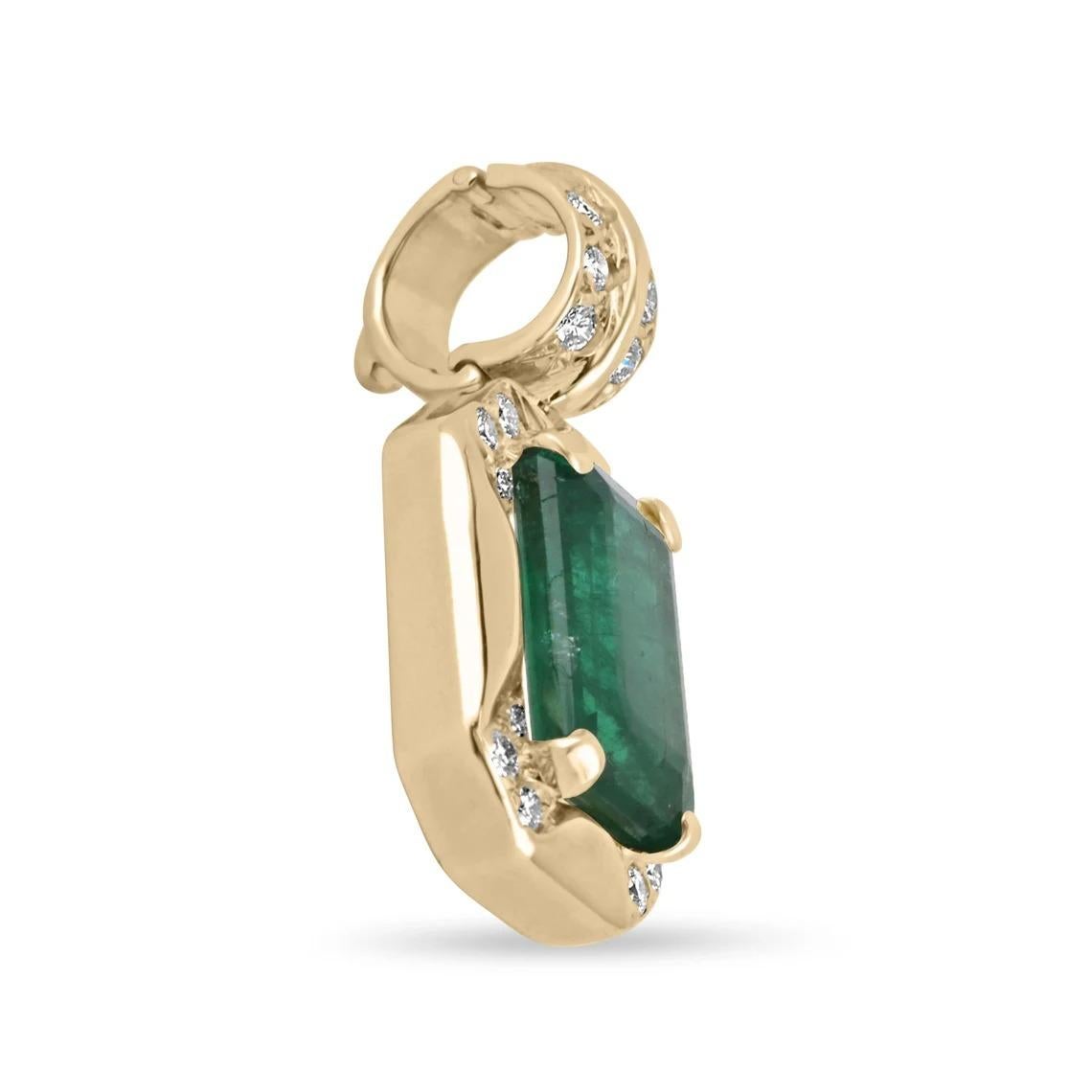 Captivate your eyes on this stunning, emerald and diamond pendant. The emerald has a full 4.55-carats of dark green color and very good luster. There are multiple other brilliant round-cut diamonds surrounding the center gem, as well as the bail.