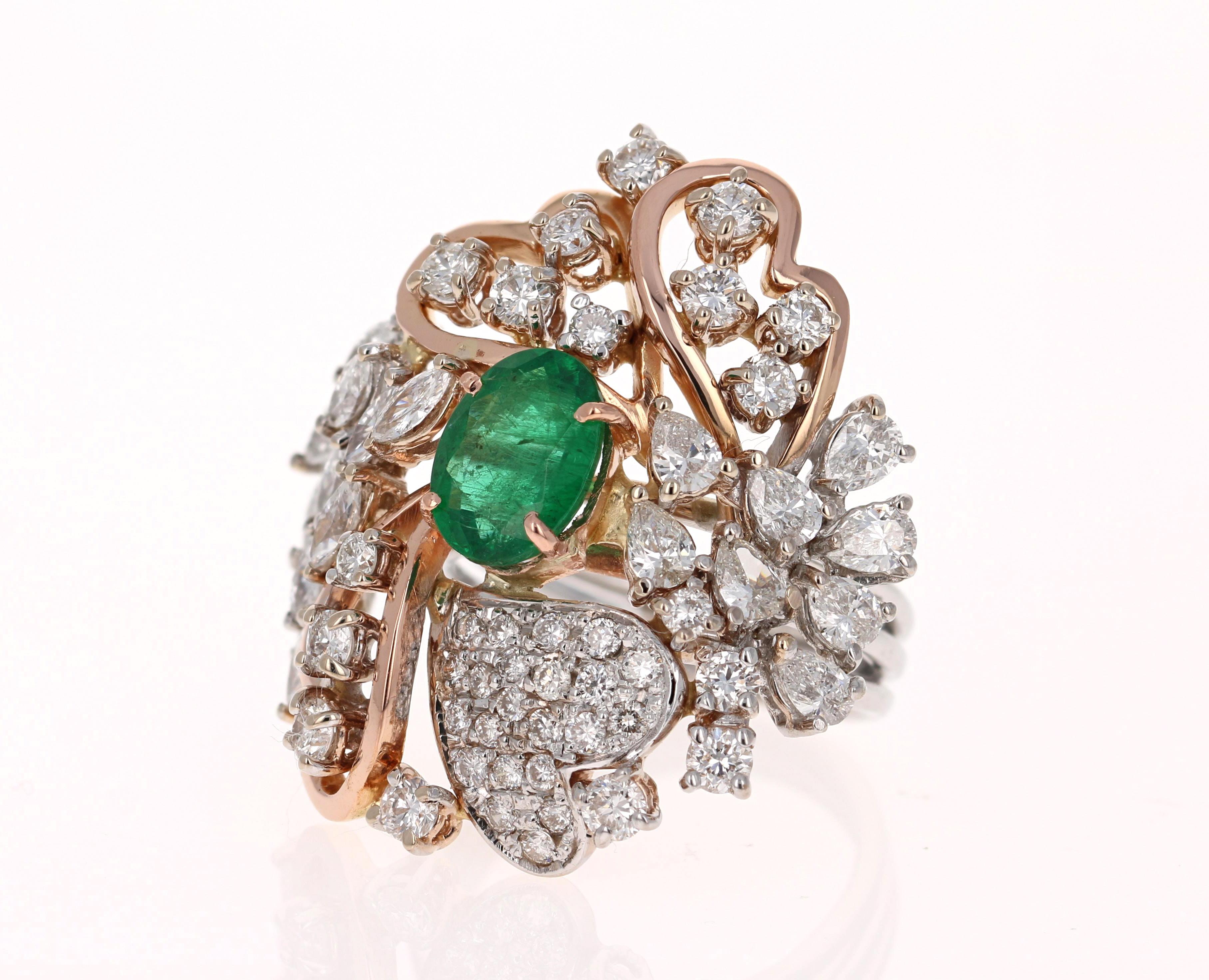 Stunning Vintage Inspired Emerald Diamond Ring! This Emerald ring is absolutely gorgeous. 
4.83 Carat Emerald and Diamond 18 Karat White Gold Vintage Cocktail Ring
8 Pear Cut Diamonds, 11 Marquise Cut Diamonds, and 40 Round Cut Diamonds = 3.10