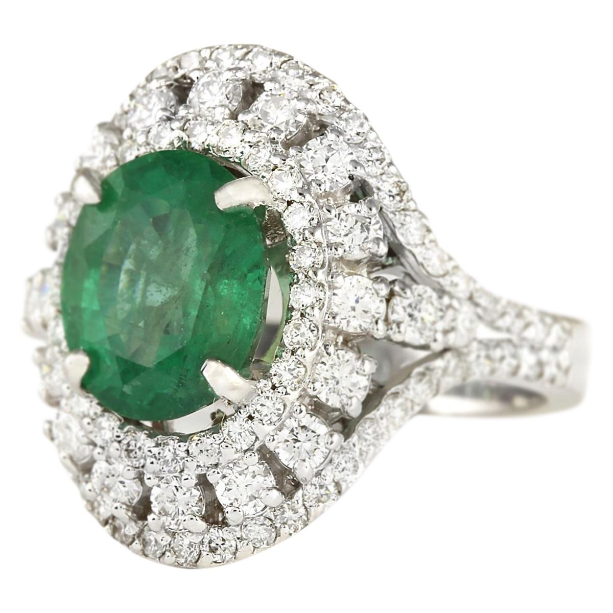 Stamped: 14K White Gold
Total Ring Weight: 8.0 Grams
Total Natural Emerald Weight is 3.13 Carat (Measures: 10.00x8.00 mm)
Color: Green
Total Natural Diamond Weight is 1.70 Carat
Color: F-G, Clarity: VS2-SI1
Face Measures: 20.25x18.45 mm
Sku: