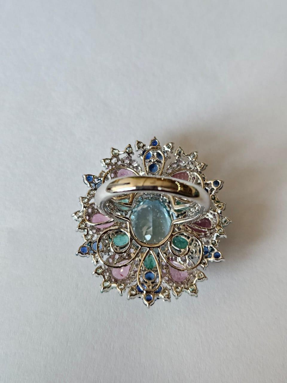Modern 4.83 carats, Aquamarine, Blue & Pink Sapphires, Emerald & Diamonds Cocktail Ring For Sale