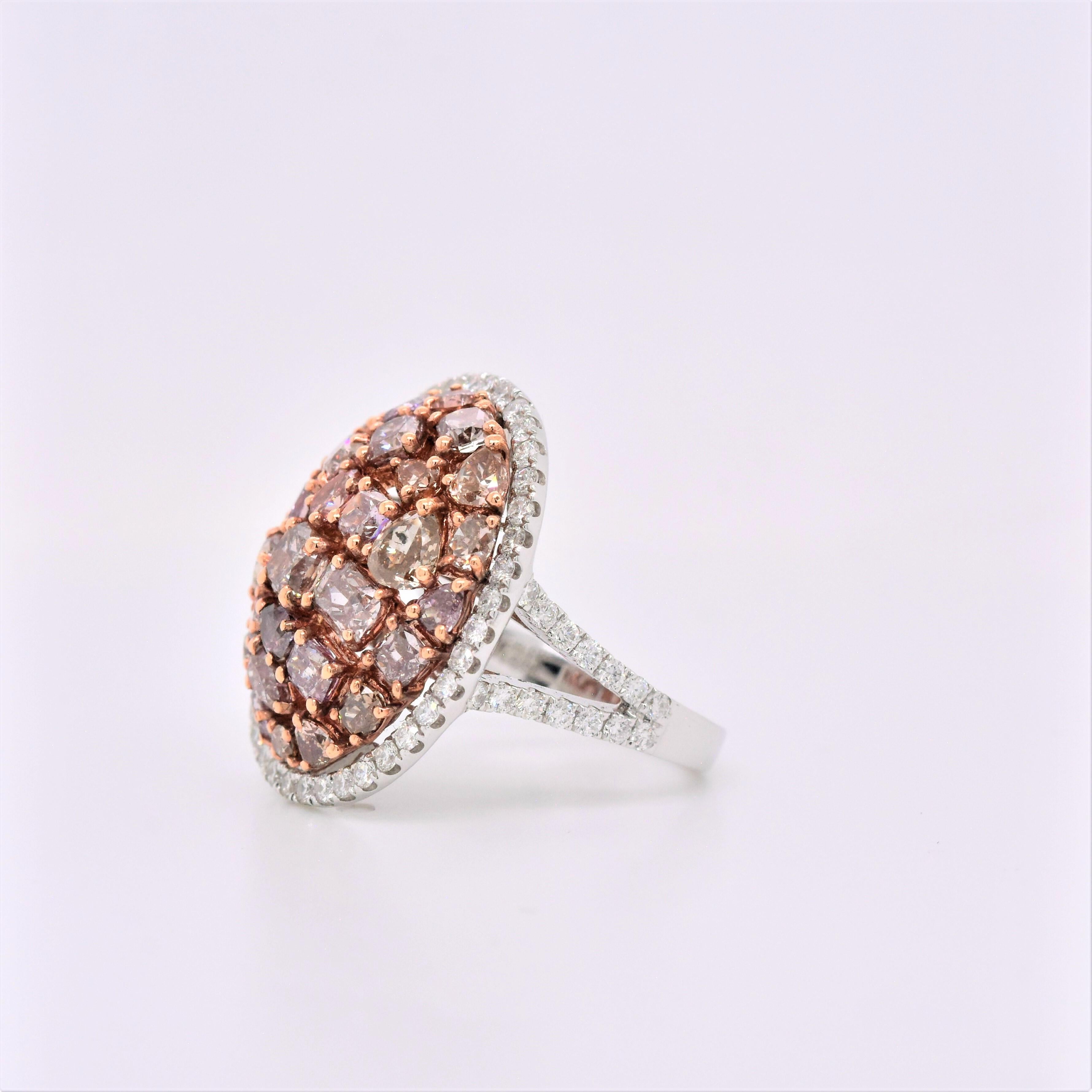 Stylish 4.84 Carat Natural Pink Mixed Cut Diamond Cluster Ring with a Halo of White Diamonds.
Total Carat Weight: 4.84 Carats
Mixed Cut Natural Fancy Pink Diamonds: 3.93 Carats (total 30 stones)
Round White Diamonds: 0.91 Carats (total 68