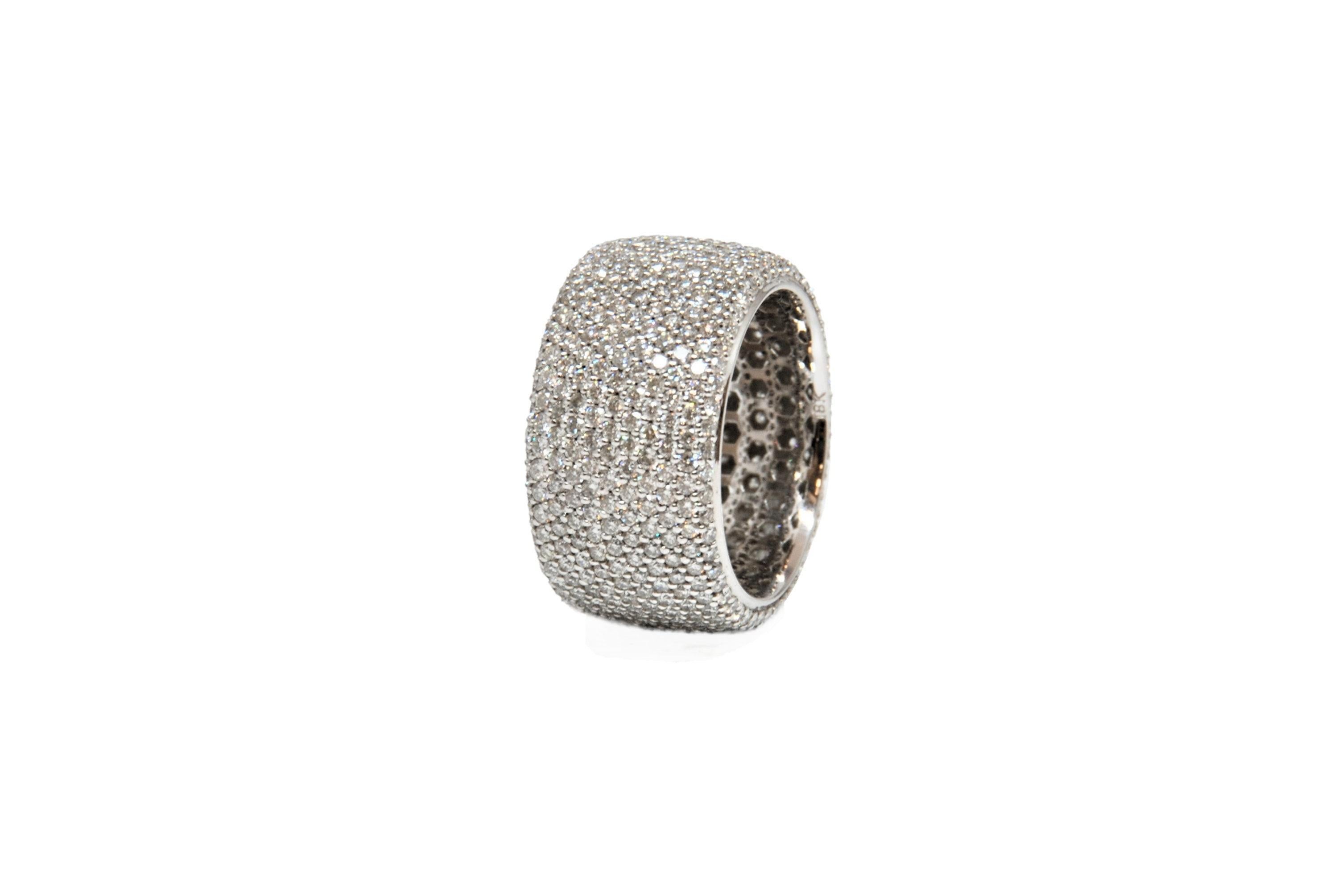 Check out this stunning pave eternity band! The ring features 561 round diamonds weighing 4.84 ct set in 18k white gold. The diamonds boast a color of G and VS in clarity. A gorgeous addition to any wardrobe.