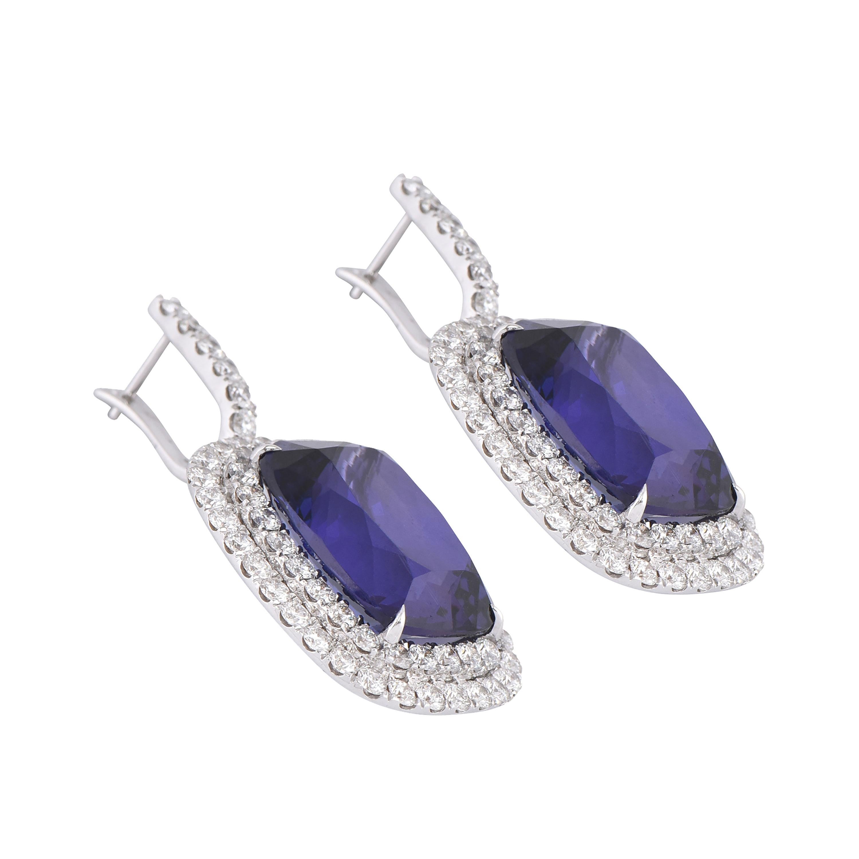 A pair 18 karat white gold dangle earrings from the Ultramarine collection of Laviere. The earrings, certified by IGI, are set with two cushion-cut Tanzanites weighing a total of 48.47 carats and round brilliant diamonds weighing a total of 6.39