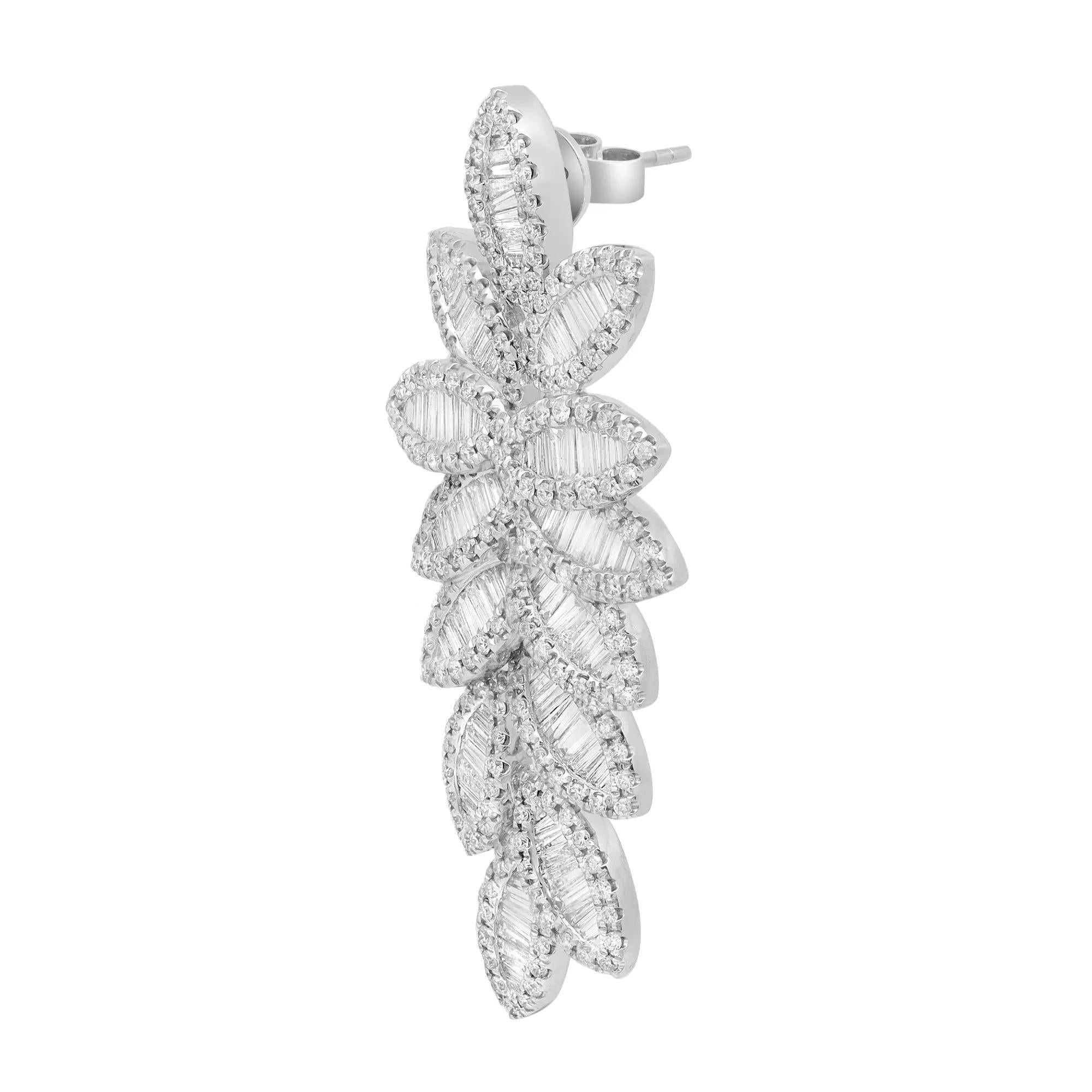 Shimmering diamonds sway along these stunning 18K white gold women's drop earrings. These earrings feature channel set baguette cut dazzling diamonds encrusted in multiple leaves shanks with round brilliant cut diamond outline. Total diamond weight: