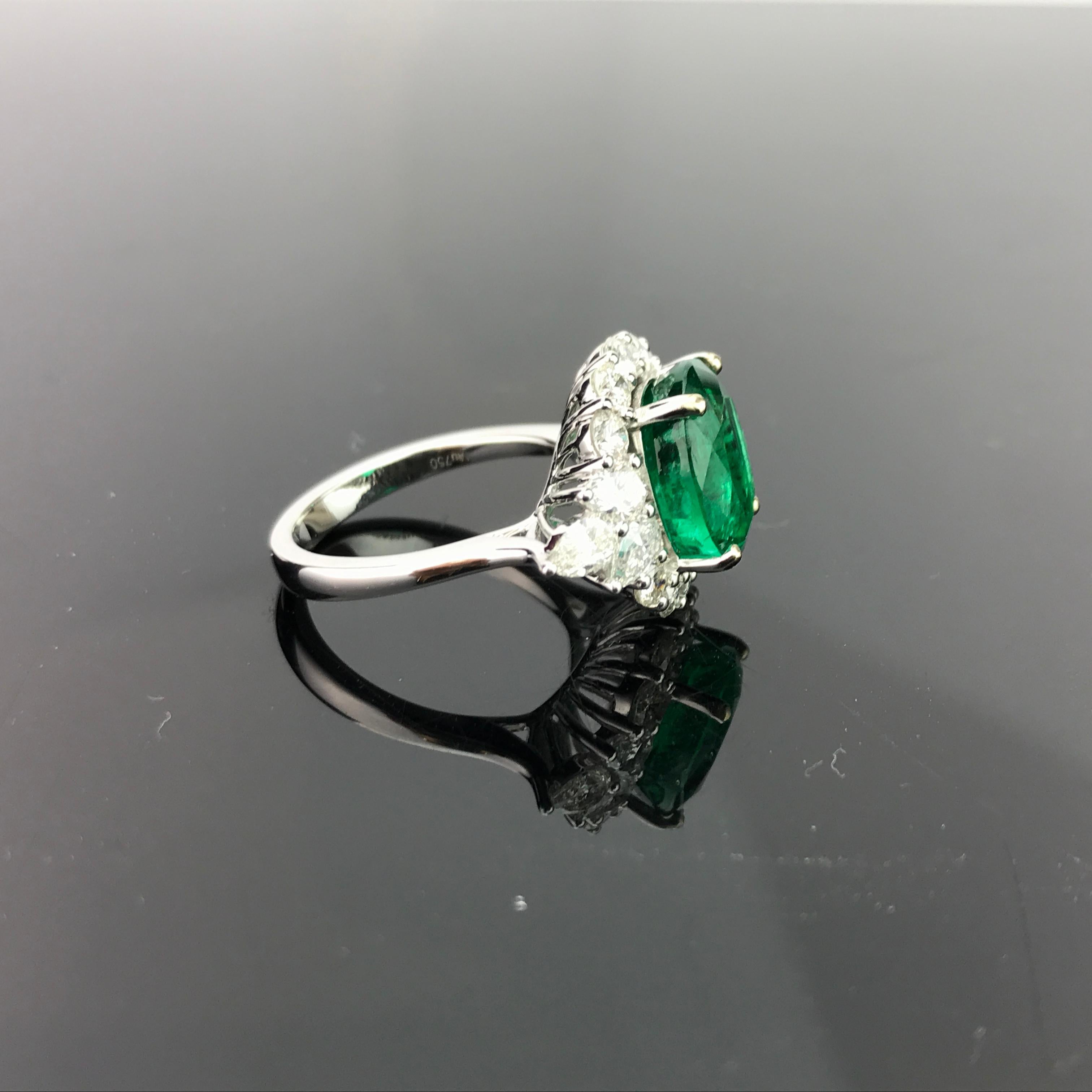 An absolutelty gorgeous Zambian Emerald with great colour and lustre, adorned with White Diamonds, all set in 18K white gold. 

Stone Details: 
Stone: Emerald
Carat Weight: 4.85 carats

Diamond Details: 
Total Carat Weight: 1.85 carat
Quality: VS ,