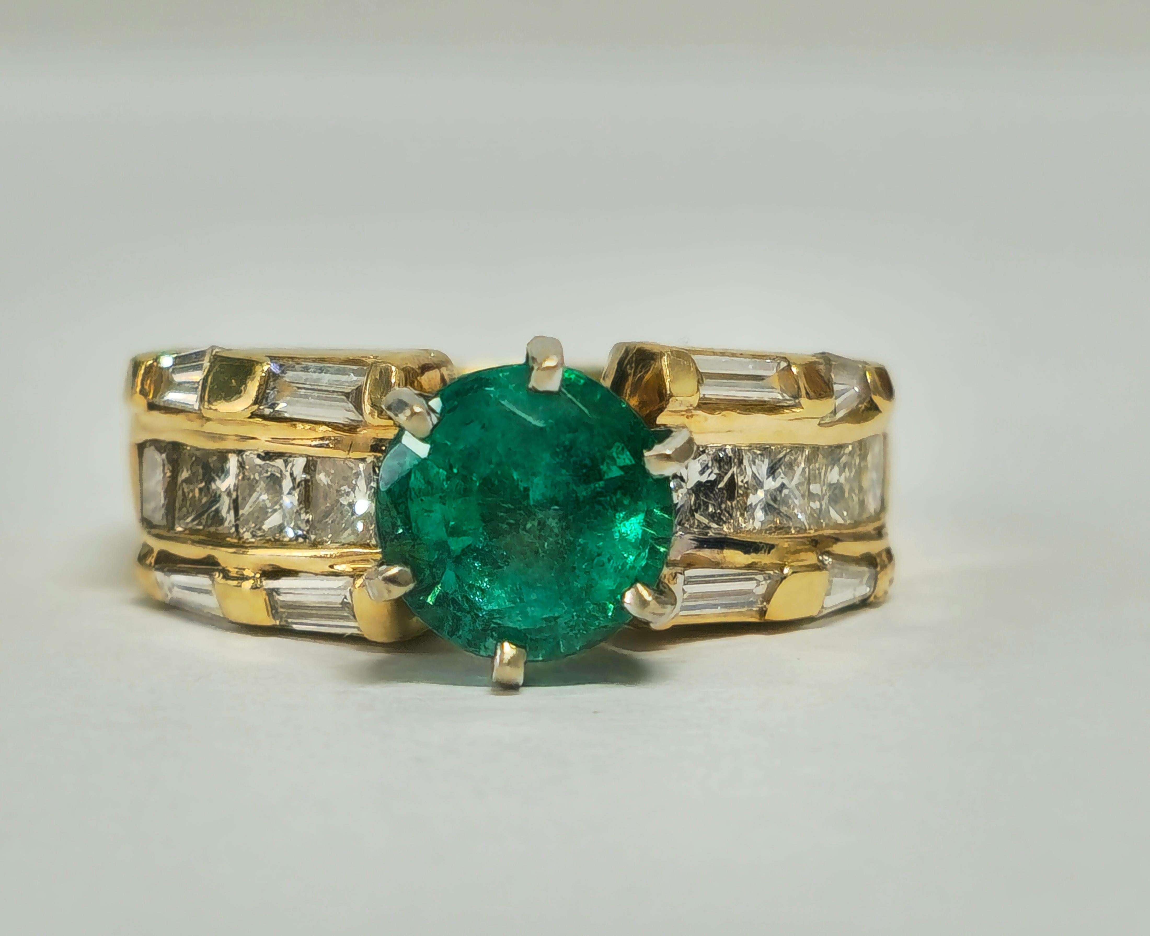 Indulge in luxury with our exquisite 14K Yellow Gold Emerald and Diamond Ring, boasting a stunning 3.10 carat round-cut emerald and 1.75 carats of baguette and princess-cut diamonds. Each stone, with VS clarity and G color, offers a total carat