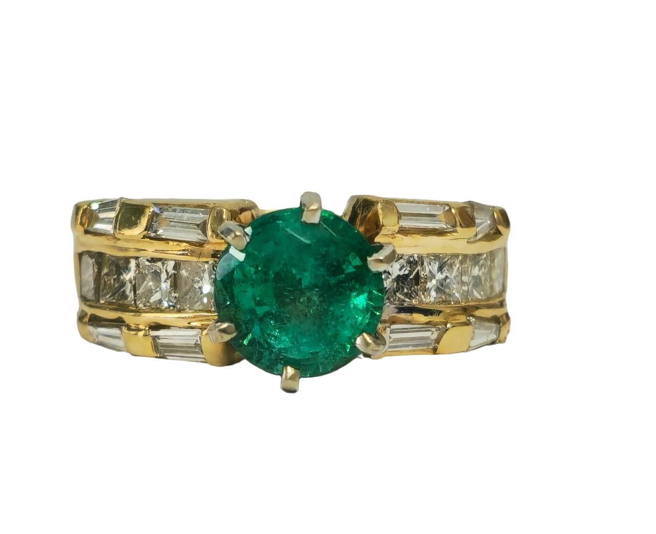 Indulge in luxury with our exquisite 14K Yellow Gold Emerald and Diamond Ring, boasting a stunning 3.10 carat round-cut emerald and 1.75 carats of baguette and princess-cut diamonds. Each stone, with VS clarity and G color, offers a total carat