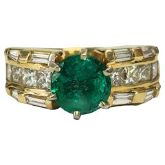 Anillo de esmeralda y diamantes de 4,85 quilates en oro amarillo de 14 quilates