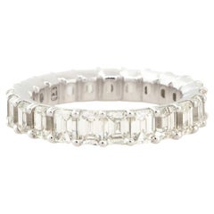 4.85 Carat Emerald Cut Diamond Eternity Band 18 Karat In Stock