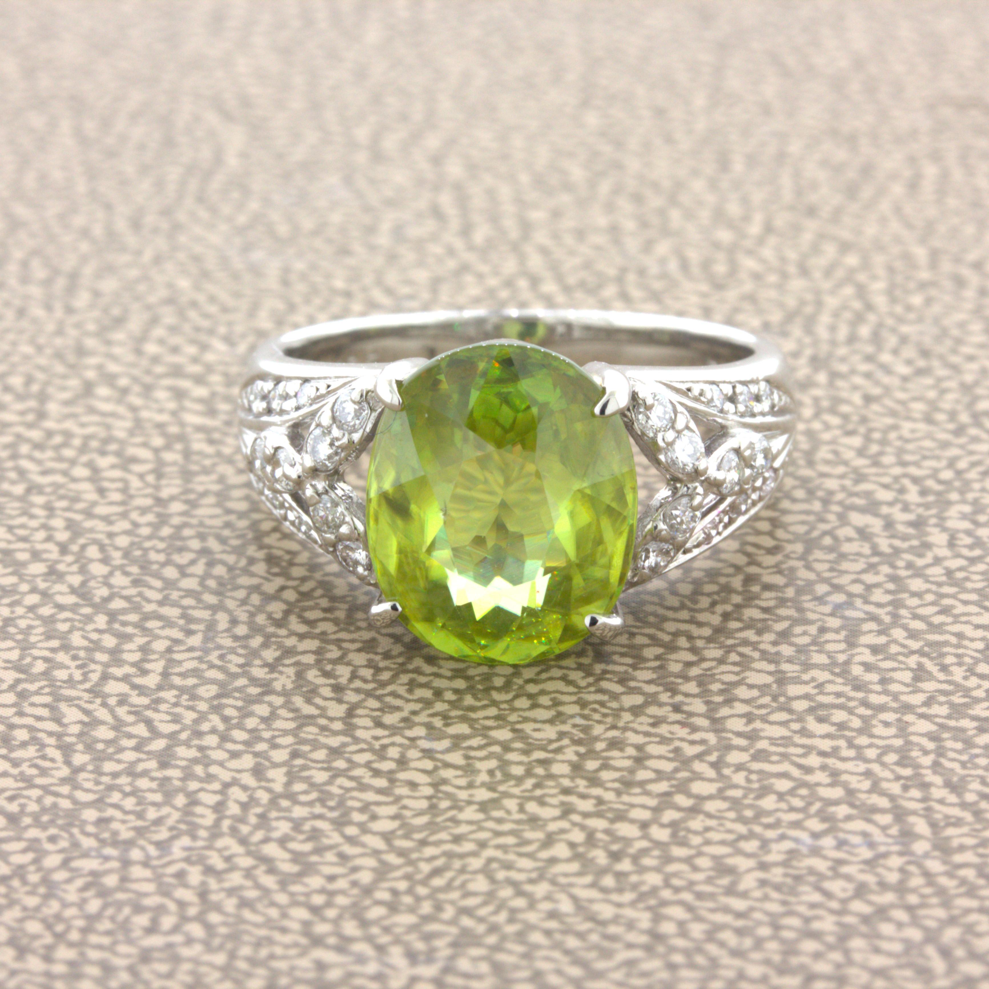 A chic and elegant platinum ring featuring a fine natural sphene. It weighs 4.85 carats and has a bright green body color along with intense fire and brilliance (more than diamond). An array of colors, red, green, blue, yellow, and more can be seen