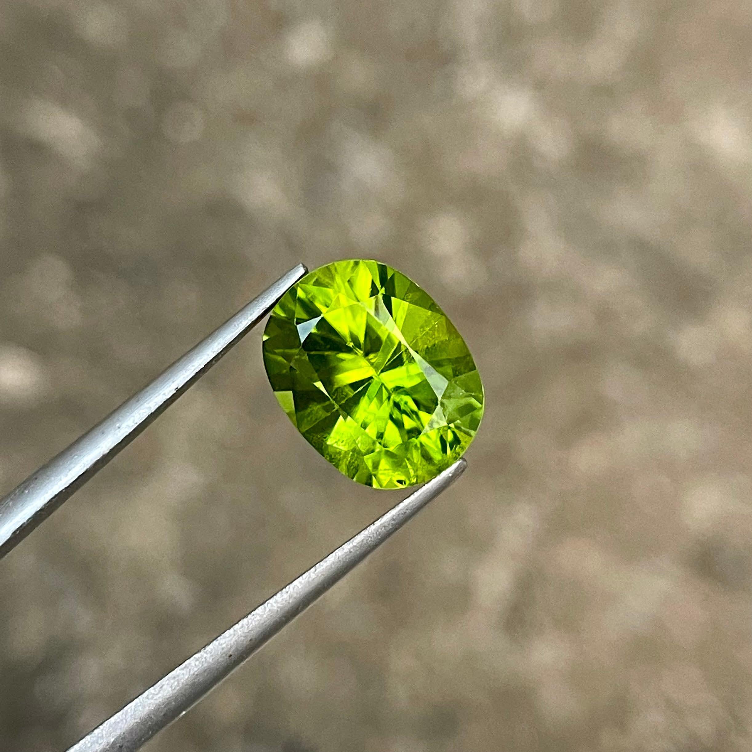 Weight 4.85 carats 
Dimensions 11.6x9.2x6.8 mm
Treatment none 
Origin Pakistan 
Clarity VS
Shape oval 
Cut custom precision 


Discover the enchanting allure of our 4.85 carat Green Peridot stone, a true gem from the heart of Pakistan. This