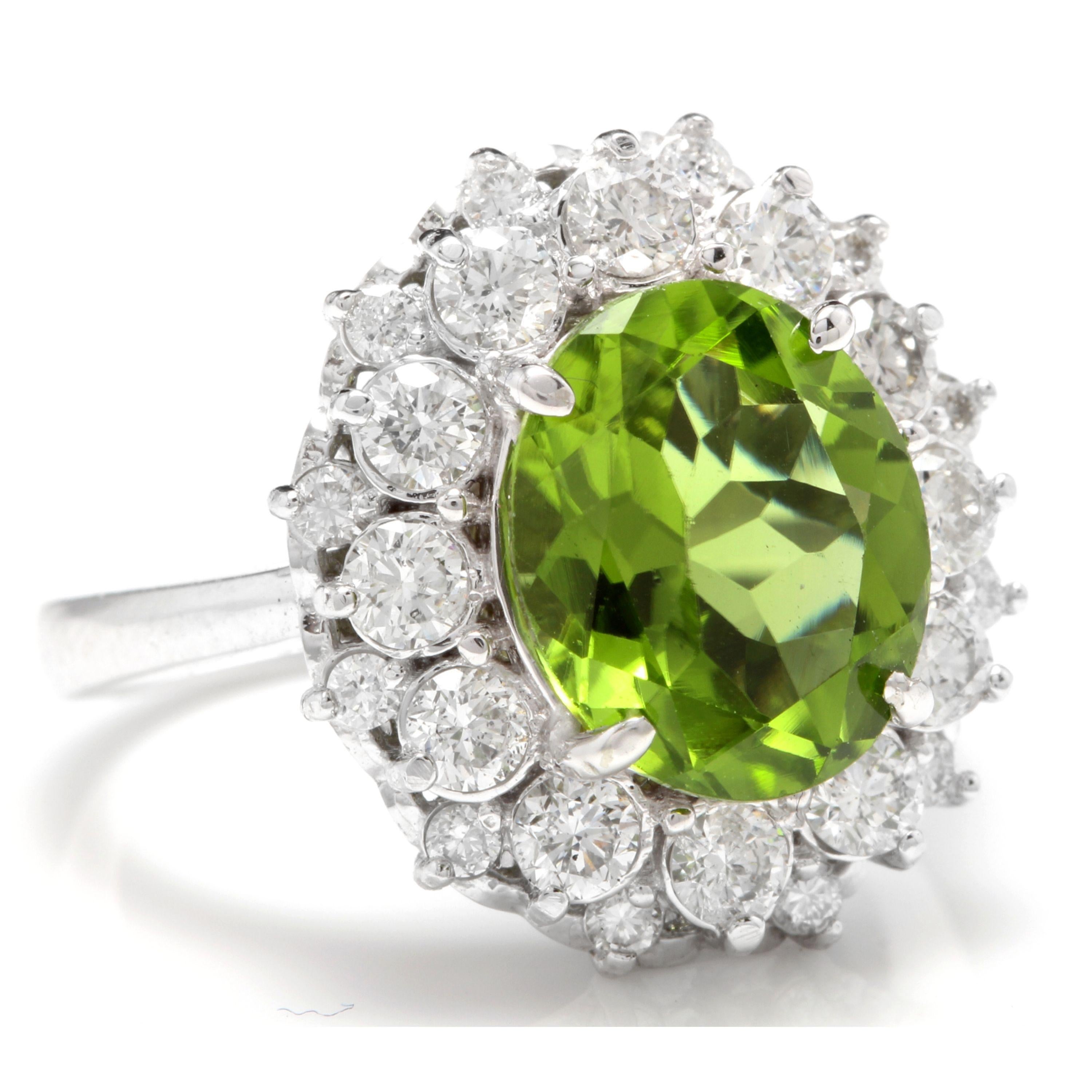 4.85 Carats Natural Very Nice Looking Peridot and Diamond 14K Solid White Gold Ring

Total Natural Oval Peridot Weight is: Approx. 3.50 Carats

Peridot Measures: Approx. 11 x 9mm

Natural Round Diamonds Weight: Approx. 1.35 Carats (color G-H /