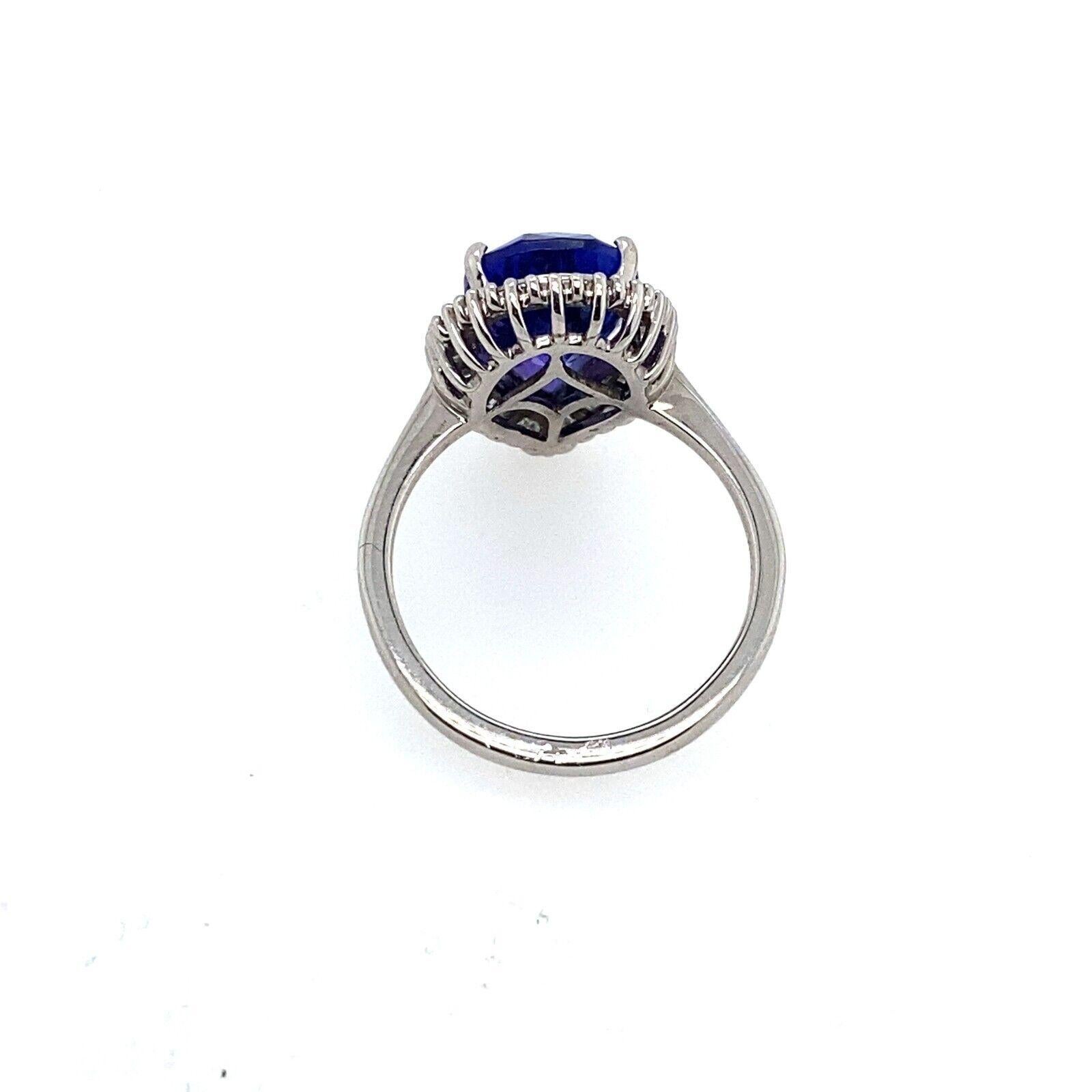Women's 4.85ct Pear Shape Natural Tanzanite Surrounded by 0.42ct of Diamonds Ring For Sale