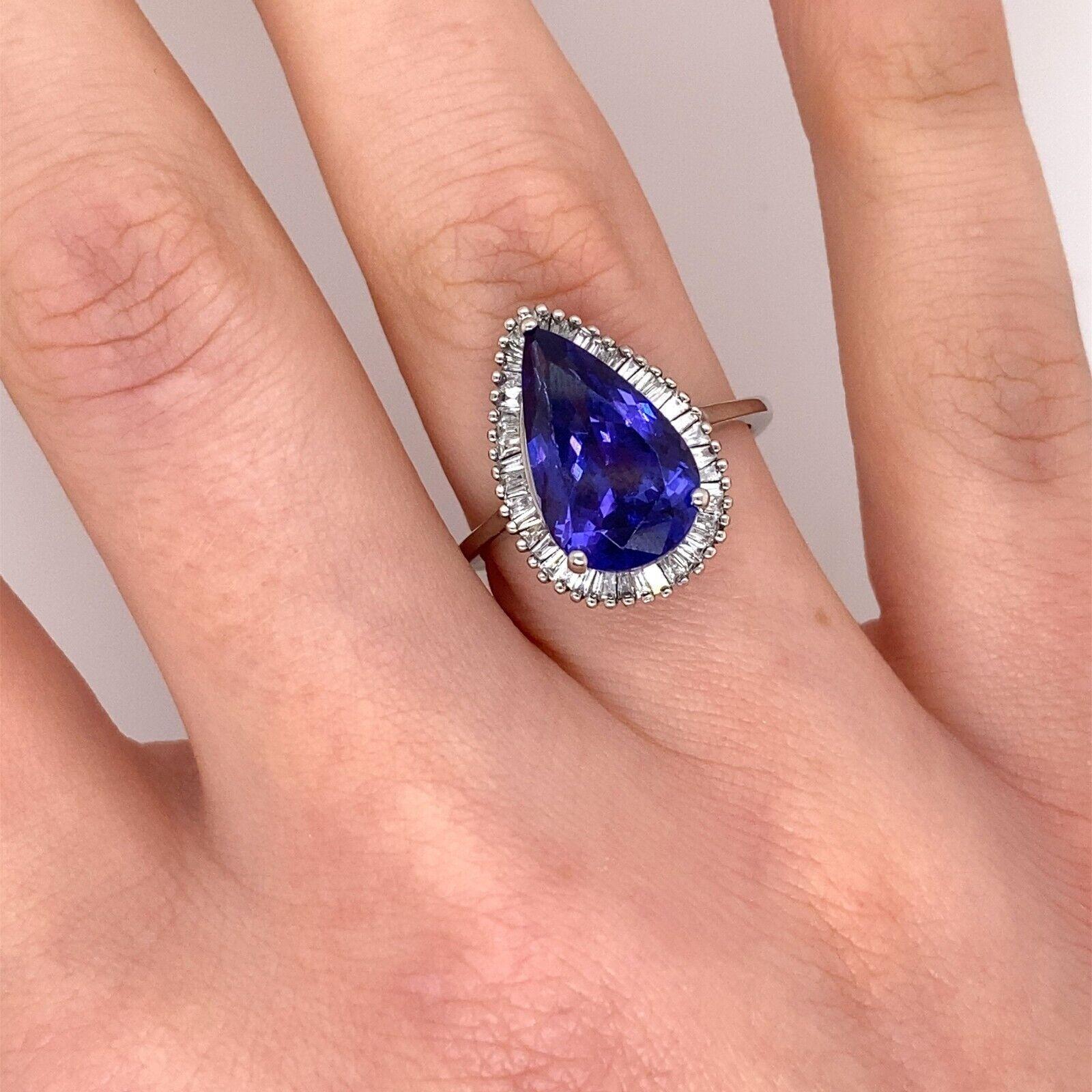 4.85ct Pear Shape Natural Tanzanite Surrounded by 0.42ct of Diamonds Ring For Sale 1