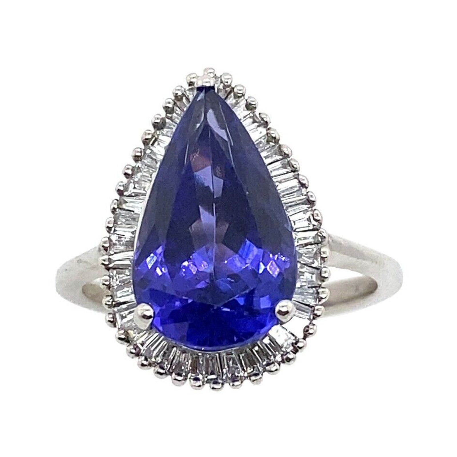 4.85ct Pear Shape Natural Tanzanite Surrounded by 0.42ct of Diamonds Ring For Sale