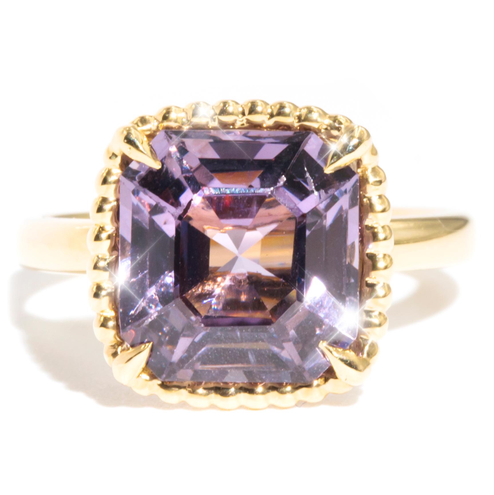 Forged in 18 carat yellow gold is this darling vintage ring featuring a breath taking 4.86 carat bright purple asscher cut spinel carefully set in a four claw, twisted rope style intricate gallery. The Nancy Ring is a minimalistic design easily