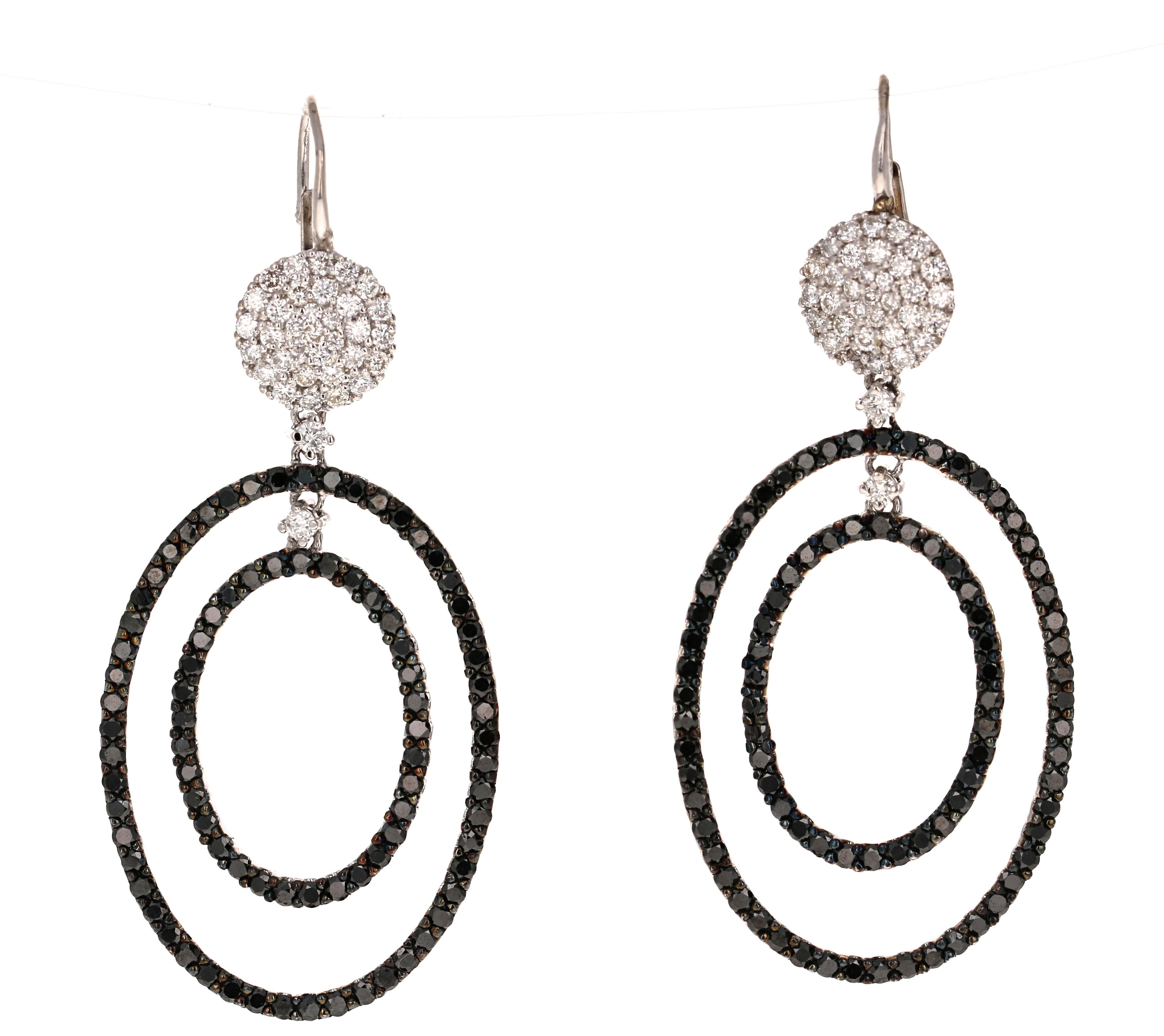 The most stunning Black and White Diamond Earrings! Classy and Chic!

These beauties have 172 Round Cut Black Diamonds that weigh 3.36 Carats and 70 Round Cut White Diamonds that weigh 1.20 Carats (Clarity: SI1, Color: F). The total carat weight of