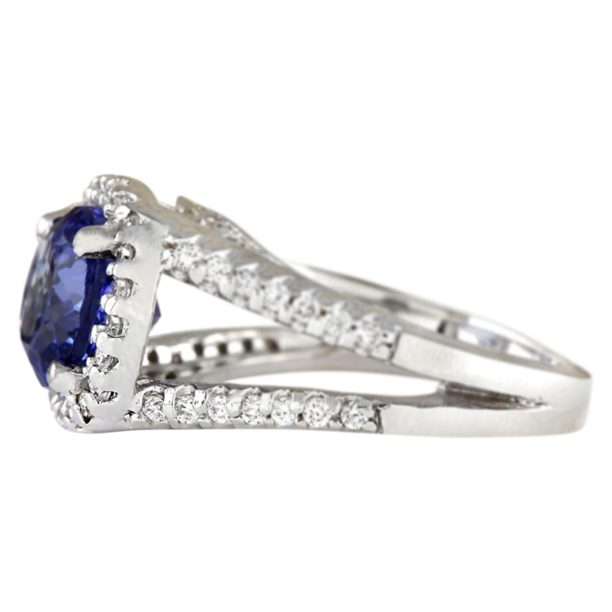 4.86 Carat Natural Tanzanite 14 Karat White Gold Diamond Ring
Stamped: 14K White Gold
Total Ring Weight: 8.7 Grams
Total Natural Tanzanite Weight is 4.16 Carat (Measures: 10.00x8.00 mm)
Color: Blue
Total Natural Diamond Weight is 0.70 Carat
Color: