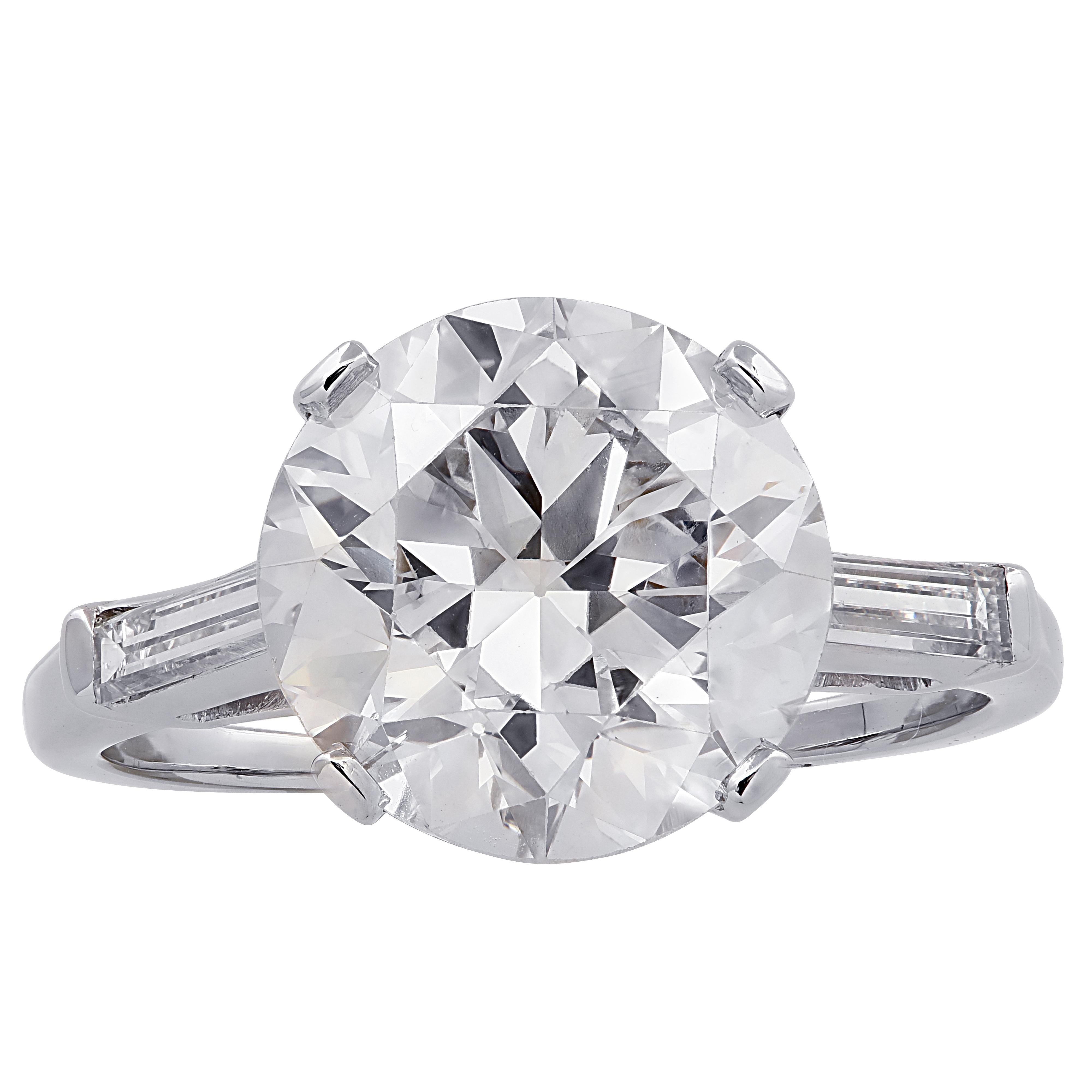Stunning engagement ring crafted in Platinum, showcasing a spectacular Old European Cut Diamond weighing 4.86 carats, K color, SI clarity, seamlessly set with 2 carefully selected and perfectly matched straight cut baguettes weighing approximately