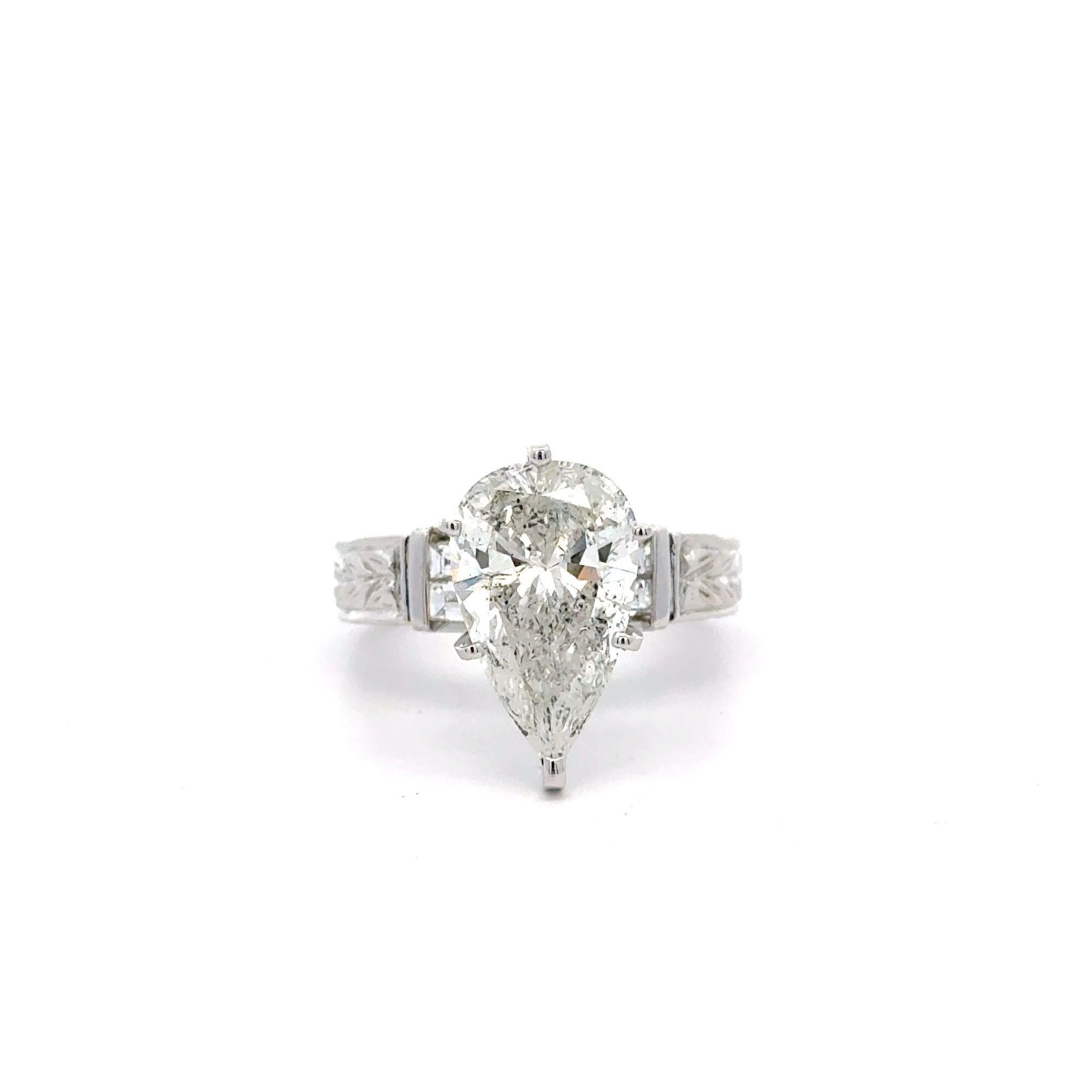 EGL Certified 4.86 Carat Pear Cut Diamond F-G/SI3 Vintage Filigree Set in 18K White Gold Engagement Ring

Details:
Metal: 18K White Gold
Setting Style: Filigree
Weight: 8.20 grams
Ring Size: 7

Center Stone Details:
Cut: Pear Modified
