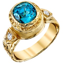 4.87 Carat Blue Zircon with 0.11 Carat Diamonds 18 Karat Yellow Gold Ring