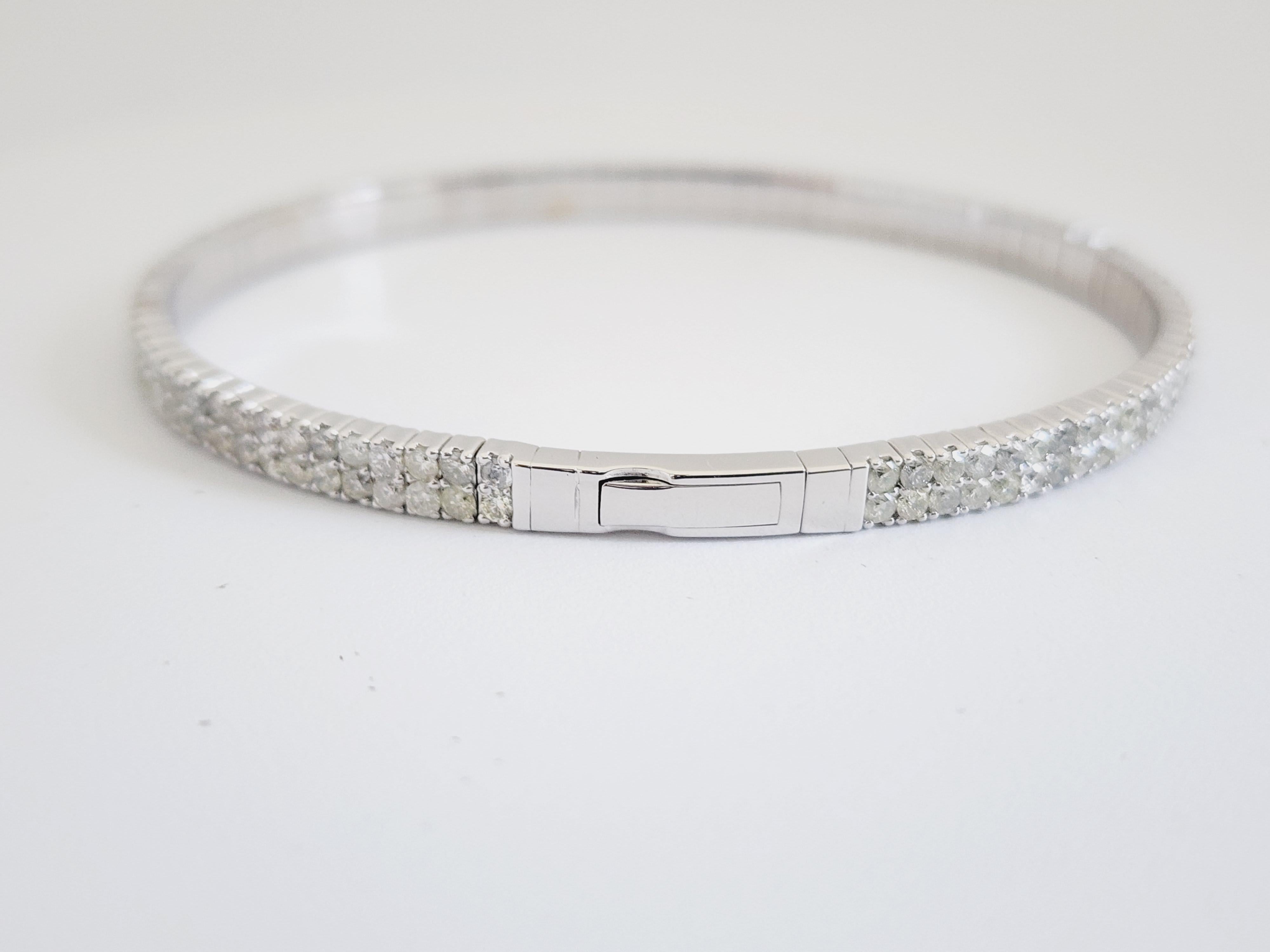 Natural Diamonds 4.87 ctw Flexible double row bangle white gold 14k 
7 Inch. Color I, Clarity I2. 4 mm wide.