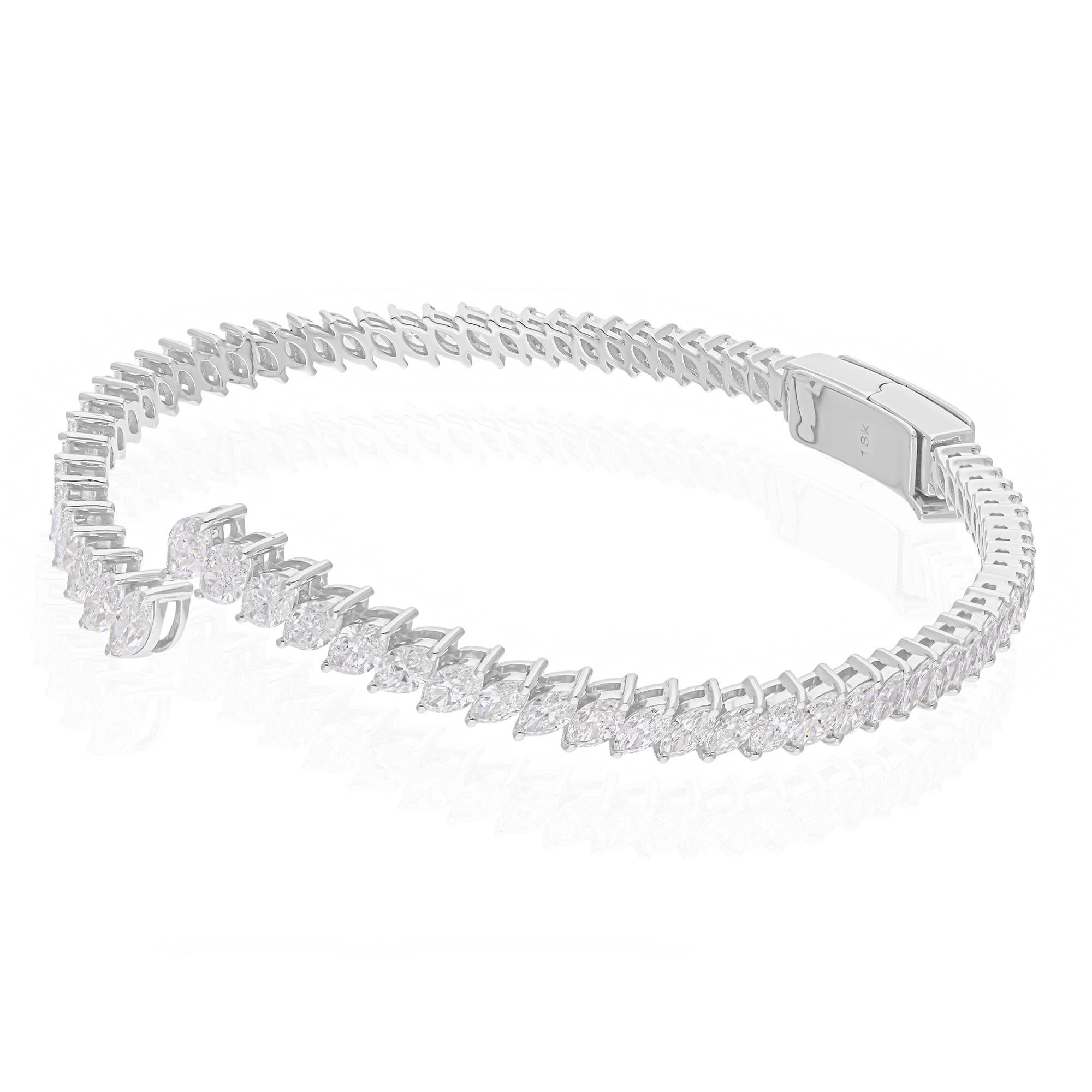 Add a touch of elegance to your collection with this exquisite 4.87 carat marquise diamond cuff bangle bracelet. Expertly crafted in 14 karat white gold, this bracelet showcases the perfect blend of modern design and timeless luxury. The marquise