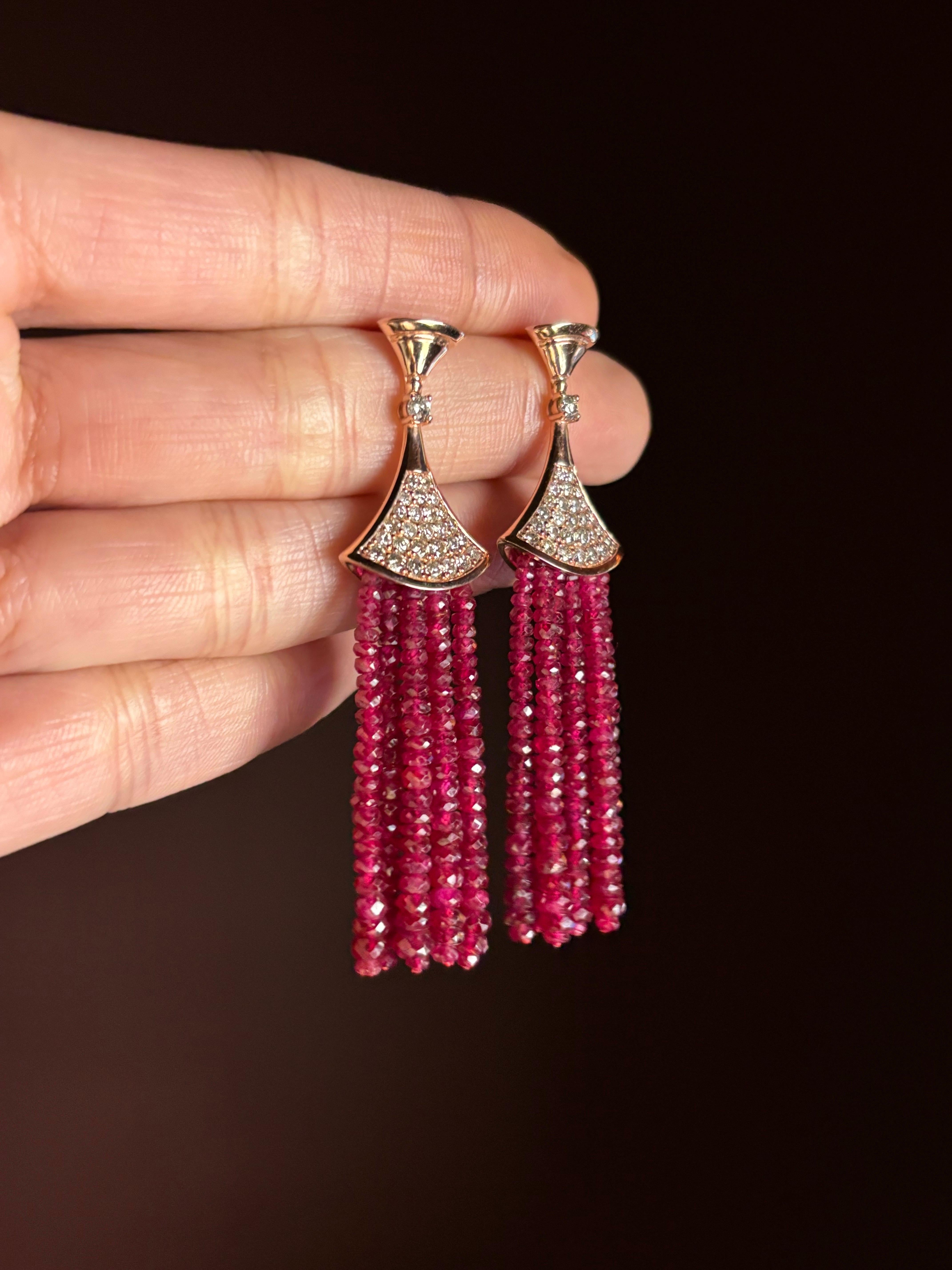 A stunning pair of 48.81 carat vivid red Ruby faceted beads dangle earrings, with 1.28 carat Diamonds set in solid 18K Rose Gold. The earrings are a total of 6cm long, and come with a push-pull backing. The earrings can be customized, we can change