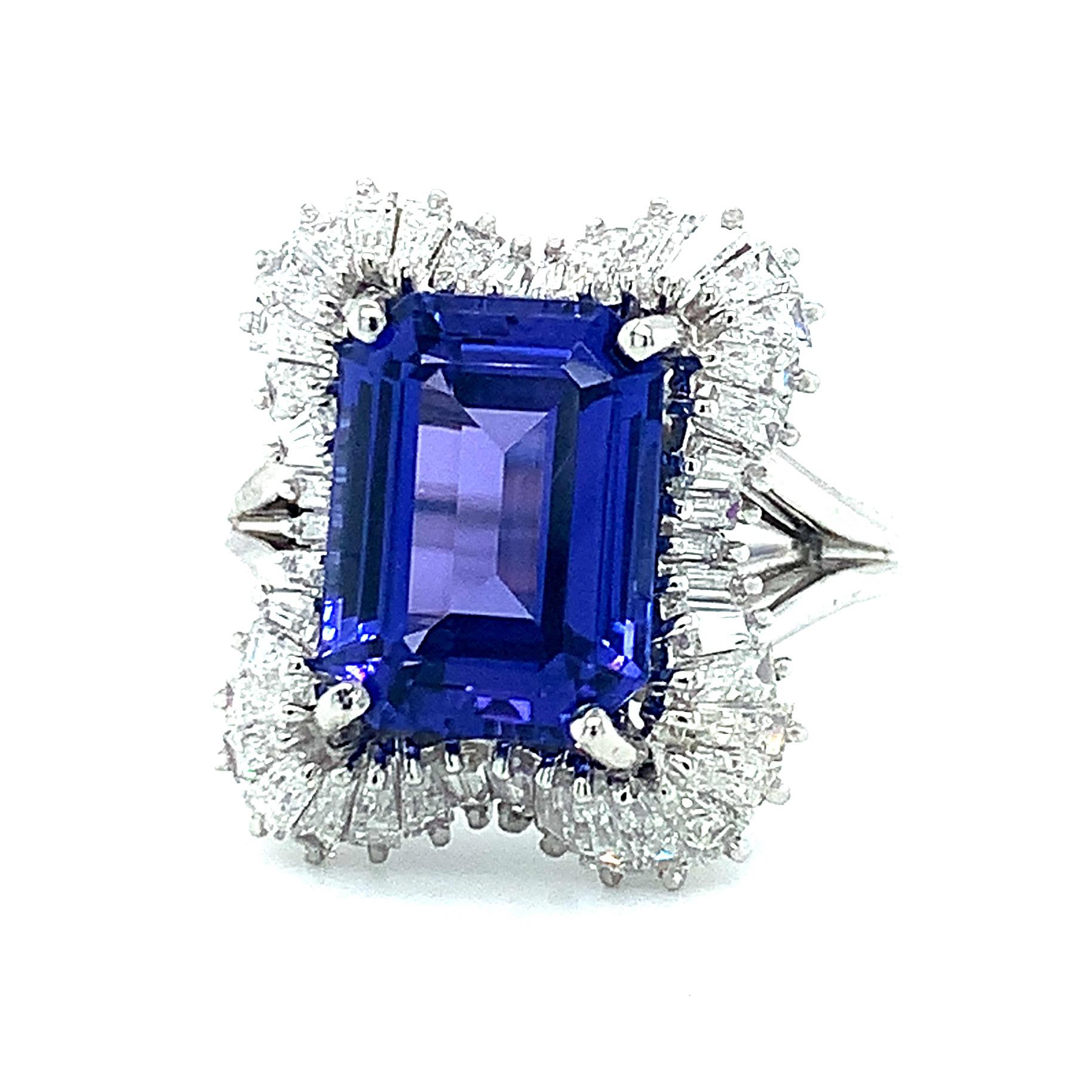 This stunning tanzanite and platinum ring is the one everyone will remember! The 4.89 carat emerald cut tanzanite literally sits center stage, framed by sparkling tapered baguette diamonds in this ever sparkling cocktail ring! The center stone has
