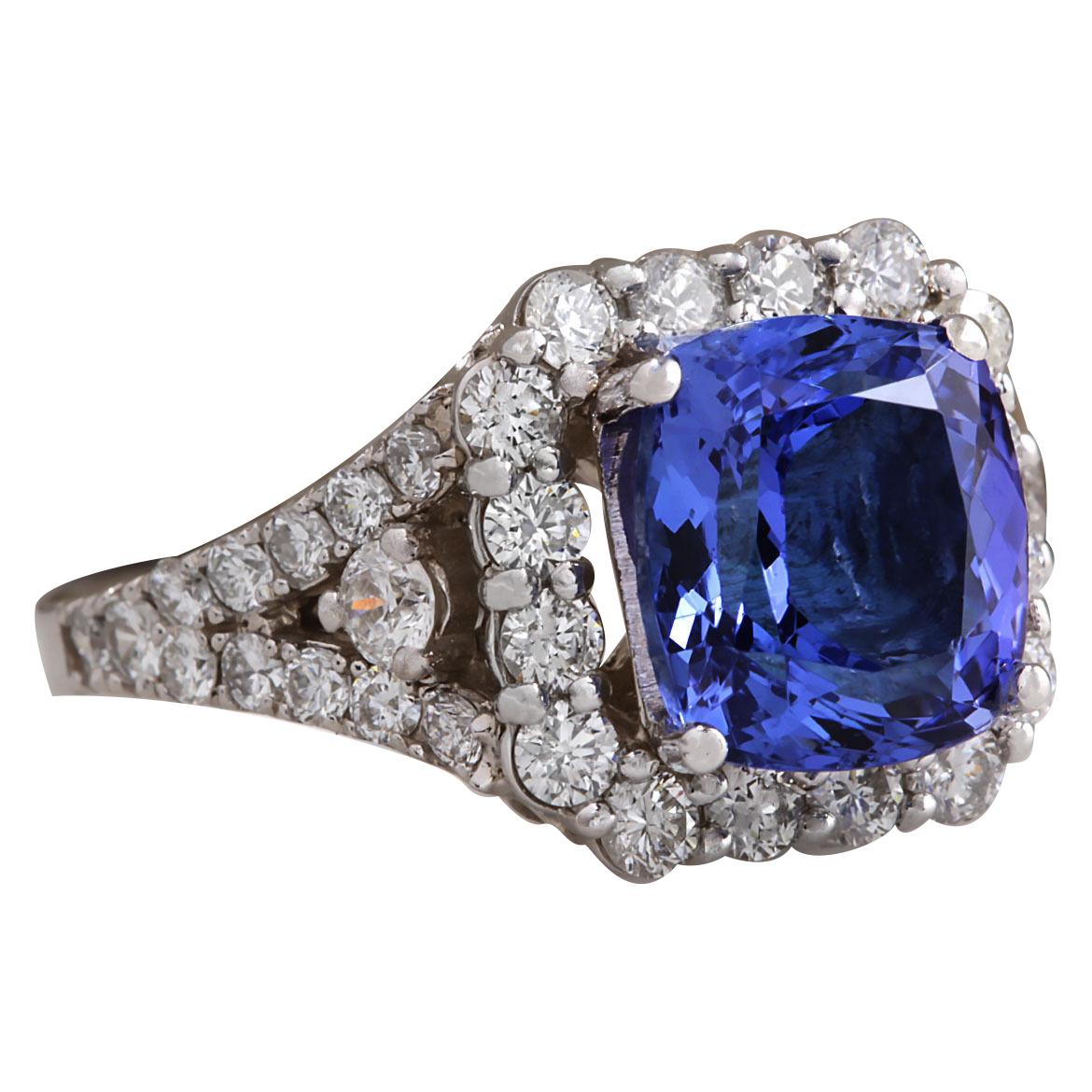 4.89 Carat Natural Tanzanite 14 Karat White Gold Diamond Ring
Stamped: 14K White Gold
Total Ring Weight: 6.0 Grams
Total Natural Tanzanite Weight is 3.76 Carat (Measures: 9.50x8.50 mm)
Color: Blue
Total Natural Diamond Weight is 1.13 Carat
Color: