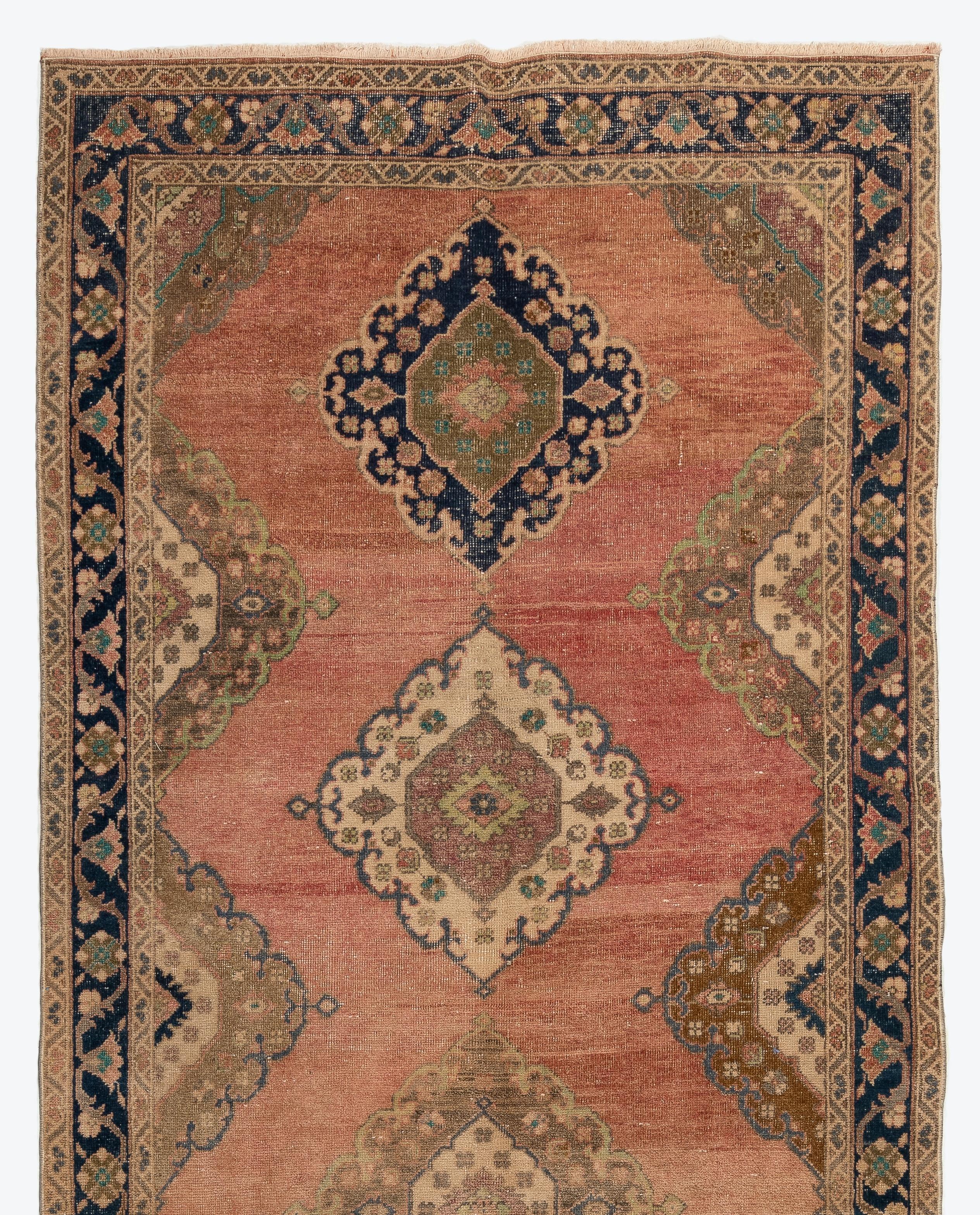 A vintage runner rug from Turkey. It is made of medium wool pile on wool foundation and features multiple medallion design in soft colors. Measures: 4.8 x 12 ft
It has been washed professionally, the rug is sturdy and can be used in both