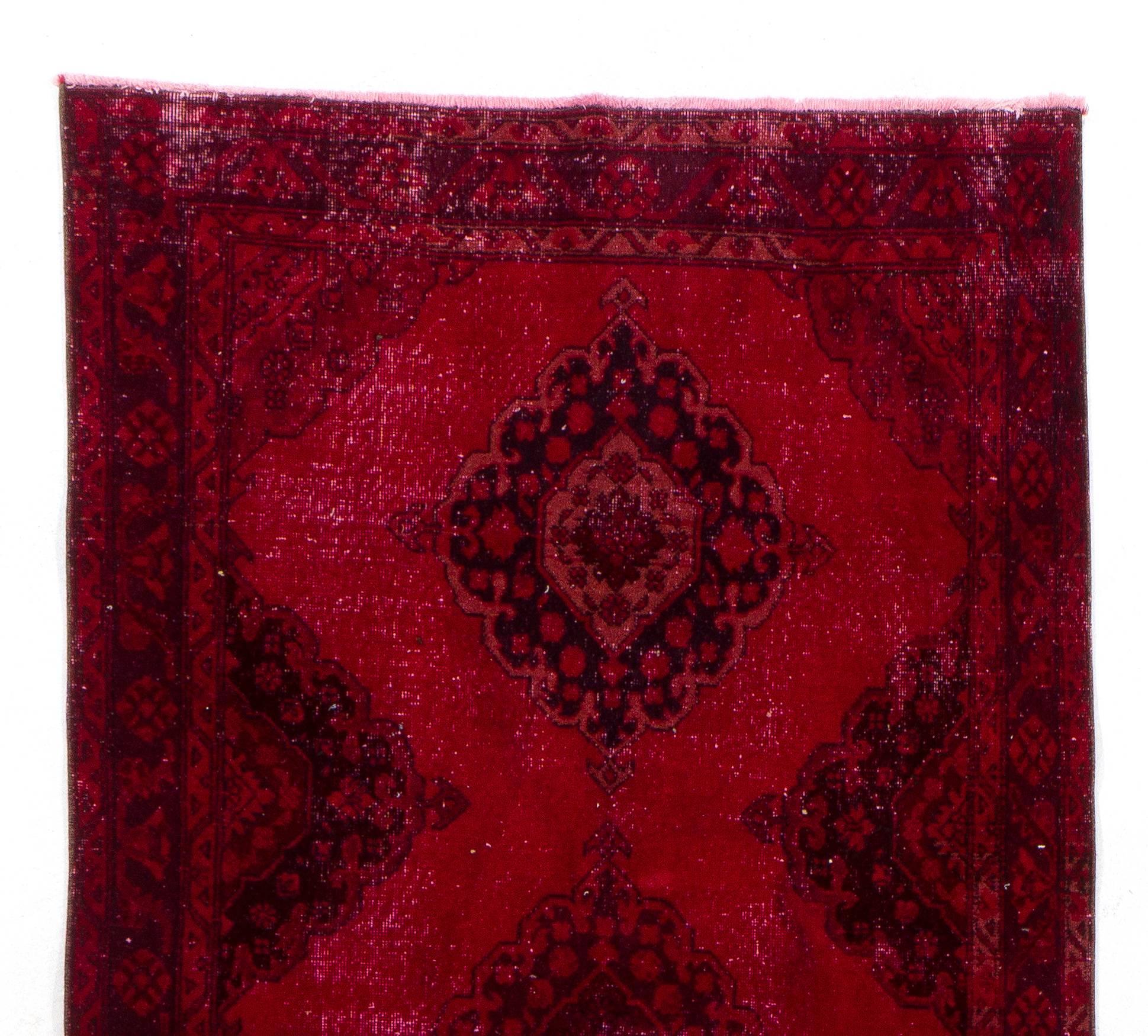 A vintage Turkish runner rug re-dyed in red color. Great for contemporary interiors.
Finely hand knotted, low wool pile on cotton foundation. Professionally washed.
Sturdy and can be used on a high traffic area, suitable for both residential and