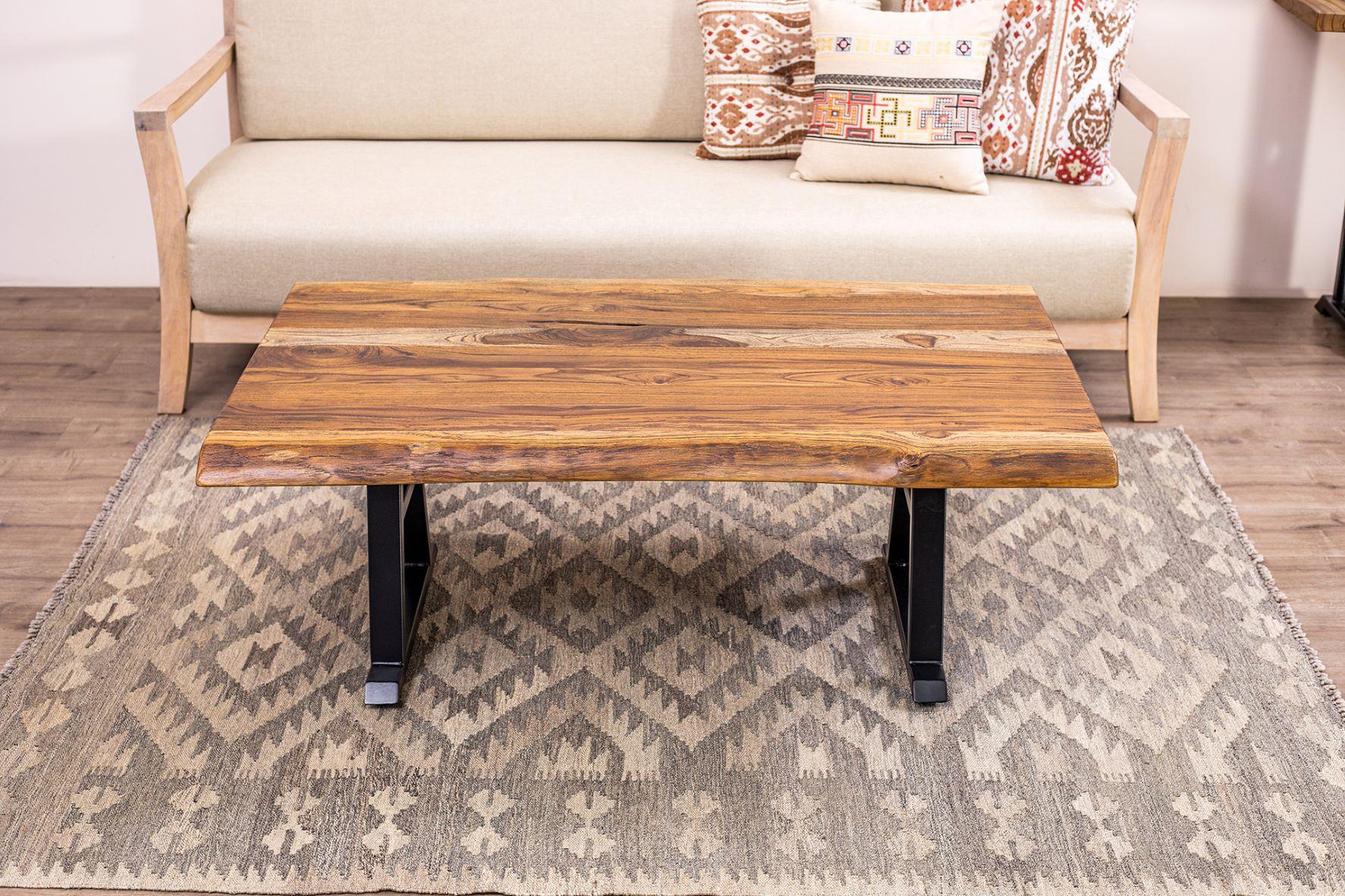 The Table Company makes only 100% solid, hardwood furniture.  We primarily use Thai/Burmese Teak, North American Red and White Oak, and old-growth Cham-Cha (Siam Acacia).  Unlike many mass-market manufacturers and retailers, our furniture is made