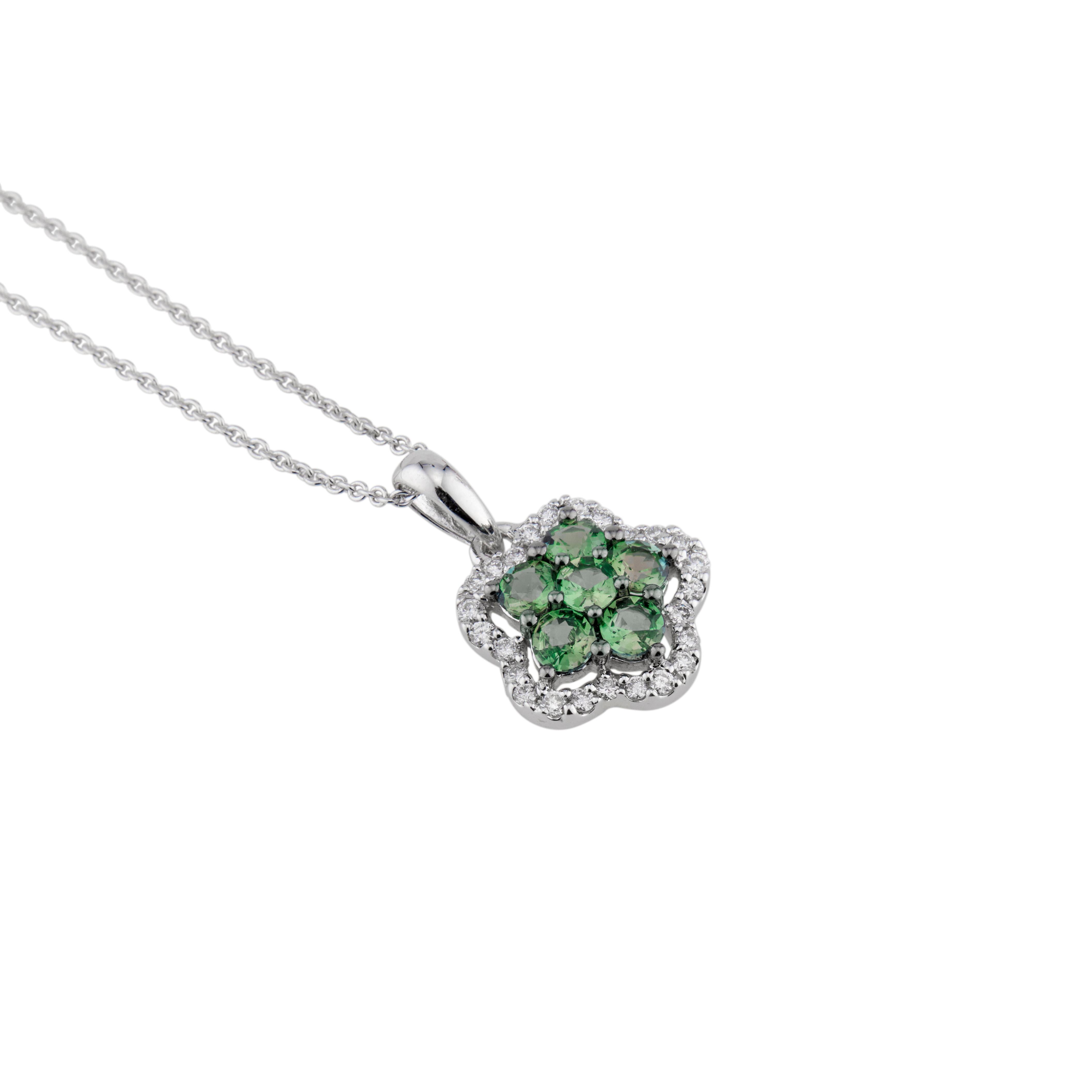 Alexandrite and diamond pendant necklace. 6 round green alexandrite's with a halo of 25 round brilliant cut diamonds. The chain is adjustable to 18 Inches and can be shortened by pulling the heart tag at the end to any length. Stamped D 012 AO 049