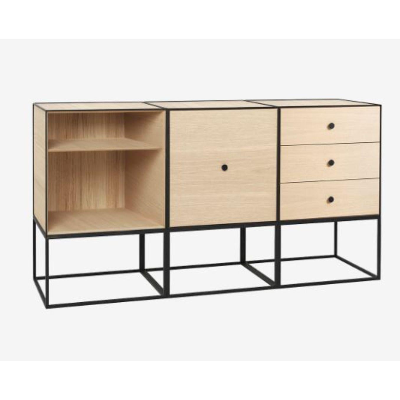 49 oak frame sideboard trio by Lassen.
Dimensions: D 147 x W 42 x H 77 cm 
Materials: Finér, melamin, melamine, metal, veneer, oak
Also available in different colors and dimensions. 
Weight: 88 kg

By Lassen is a Danish design brand focused on