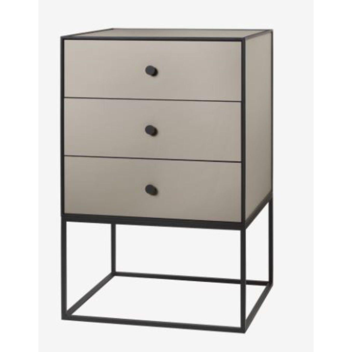 49 sand frame sideboard with 3 drawers by Lassen
Dimensions: D 49 x W 42 x H 77 cm 
Materials: Finér, melamin, melamine, metal, veneer
Also available in different colours and dimensions.
Weight: 21 kg

By Lassen is a Danish design brand