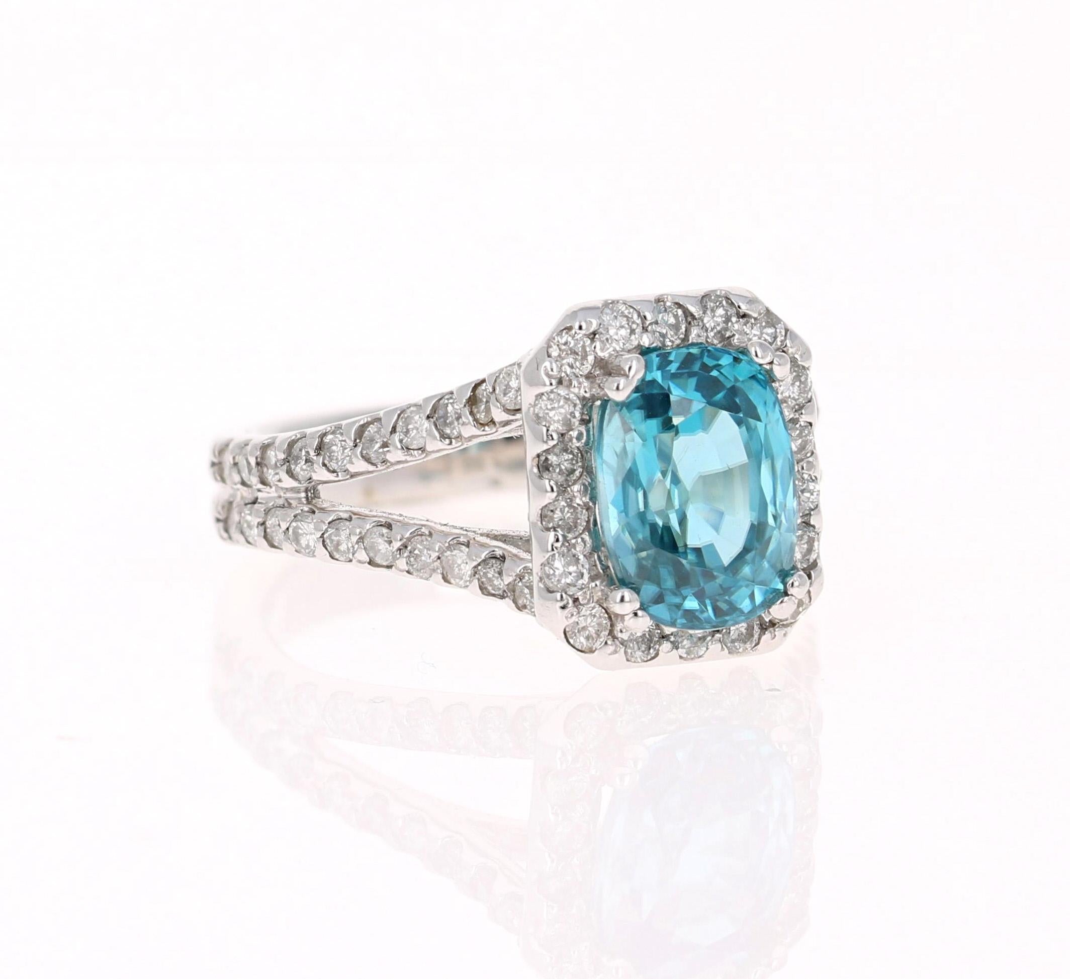 A Dazzling Blue Zircon and Diamond Ring! Blue Zircon is a natural stone mined in different parts of the world, mainly Sri Lanka, Myanmar, and Australia. 

This Blue Zircon is 4.00 Carats and is surrounded by a halo and split shank of 58 Round Cut