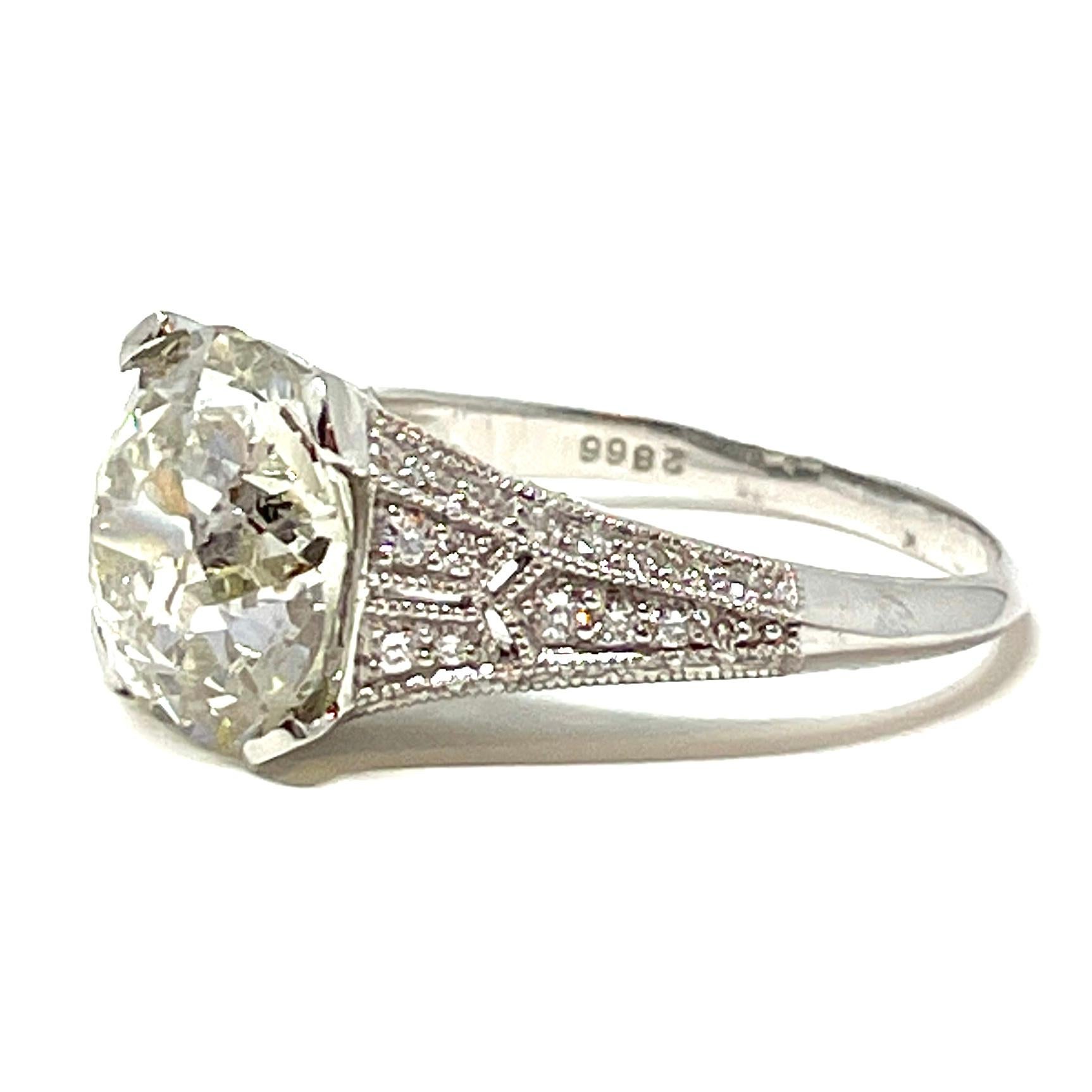 4.90 Carat Old European Cut Diamond in a Diamond and Platinum Ring In New Condition For Sale In New Orleans, LA