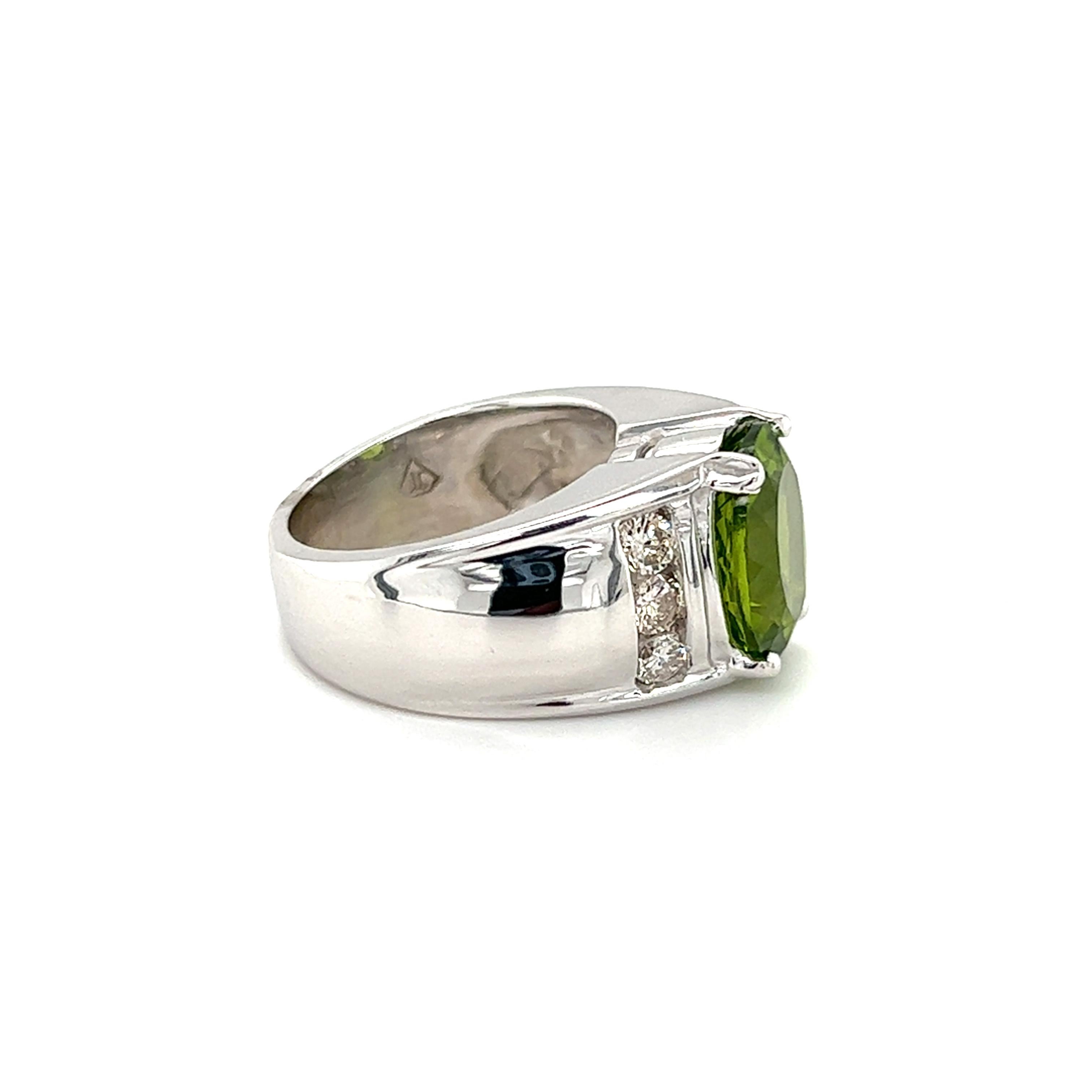 Contemporary 4.90 Carat Oval Peridot and Diamond Ring in 14K Gold