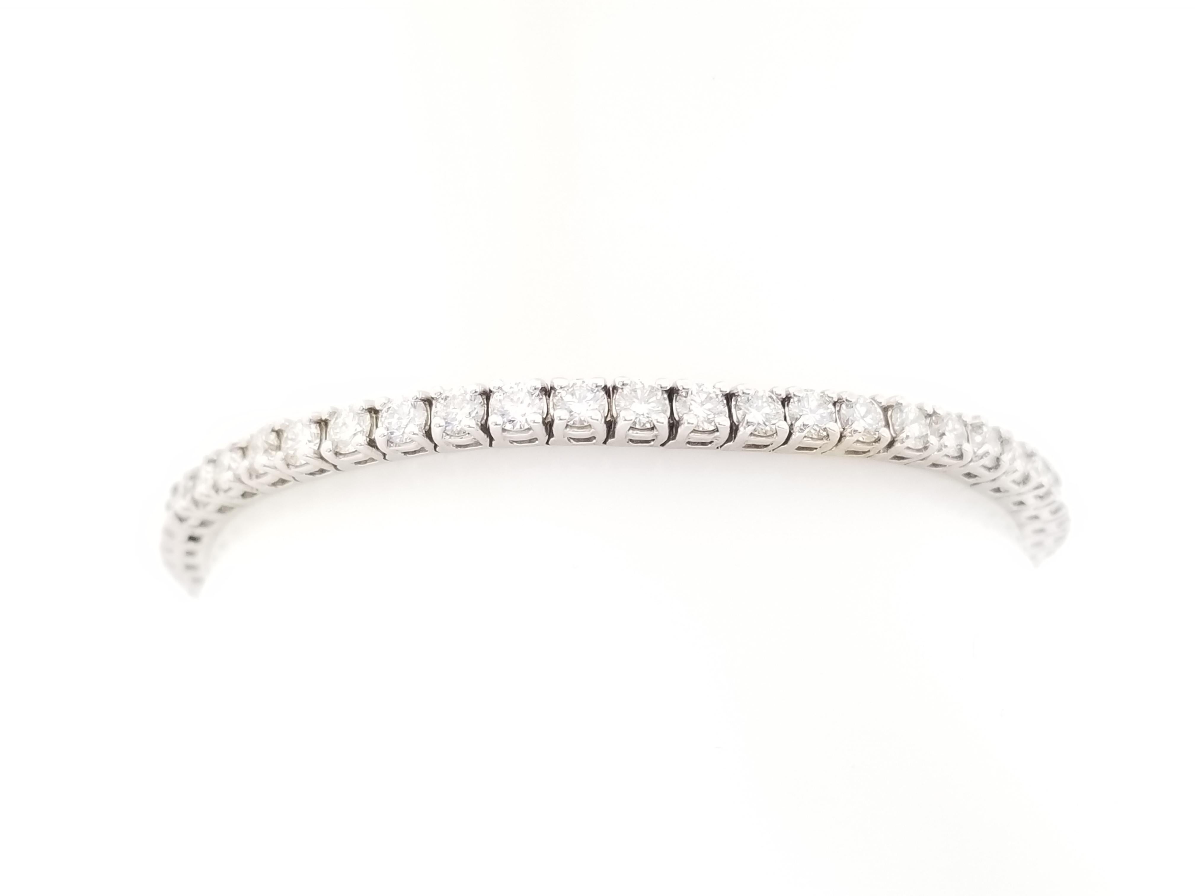 Brilliant and beautiful, set on 14K white gold. each stone is set in a classic four-prong style for maximum light brilliance. Bright and Shiny, Bold and Beautiful.

Natural Diamond 4.91 ctw
7 inch length. 
Average Color I, Clarity SI 
3.2 mm