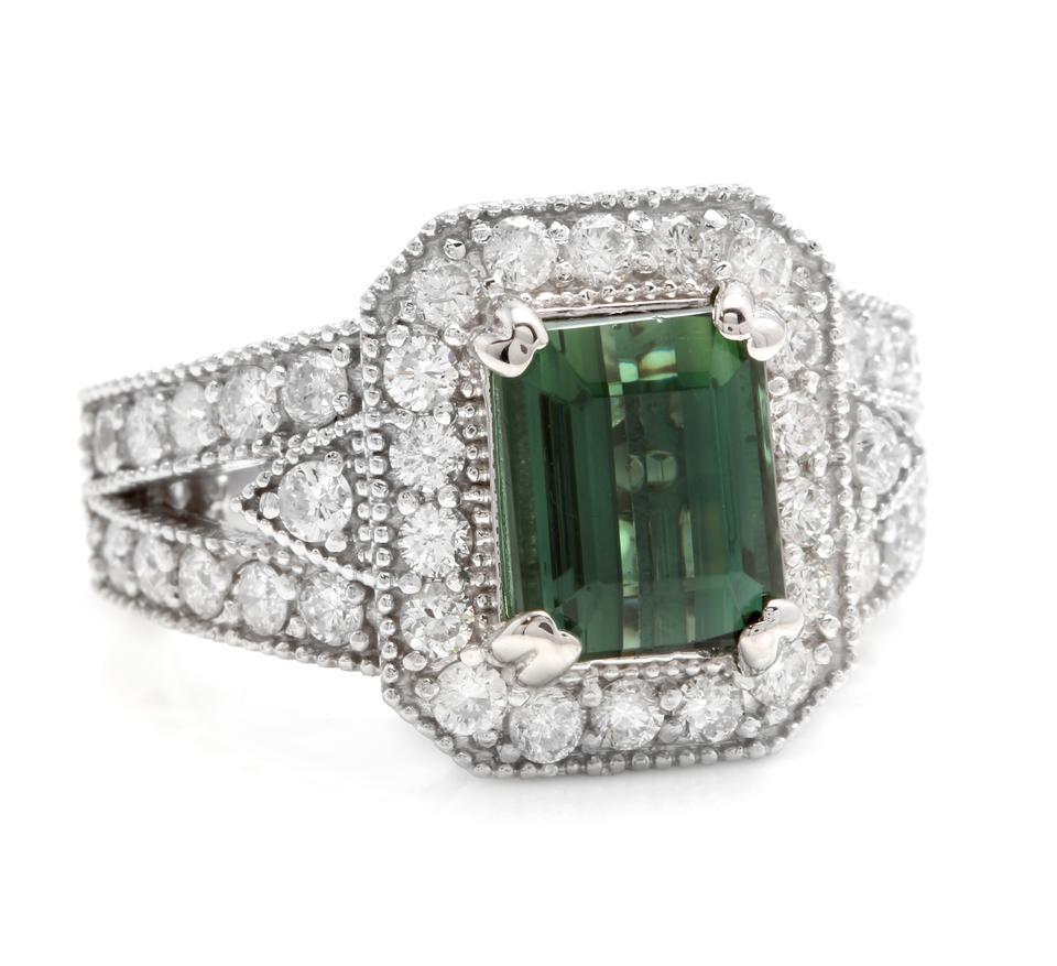 4.90 Carats Natural Green Tourmaline and Diamond 18K Solid White Gold Ring

Total Natural Emerald Cut Tourmaline Weight is: Approx. 3.70 Carats (Treatment-Heat)

Tourmaline Measures: Approx. 9.00 x 7.00mm

Natural Round Diamonds Weight: 1.20 Carats