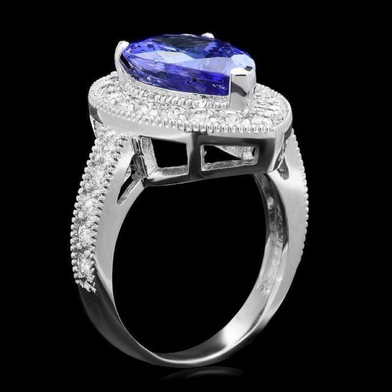 4.90 Carats Natural Tanzanite and Diamond 14K Solid White Gold Ring

Total Natural Tanzanite Weight is: Approx. 3.90 Carats 

Tanzanite Measures: Approx. 13.00 x 9.00mm

Natural Round Diamonds Weight: Approx. 1.00 Carats (color G-H / Clarity