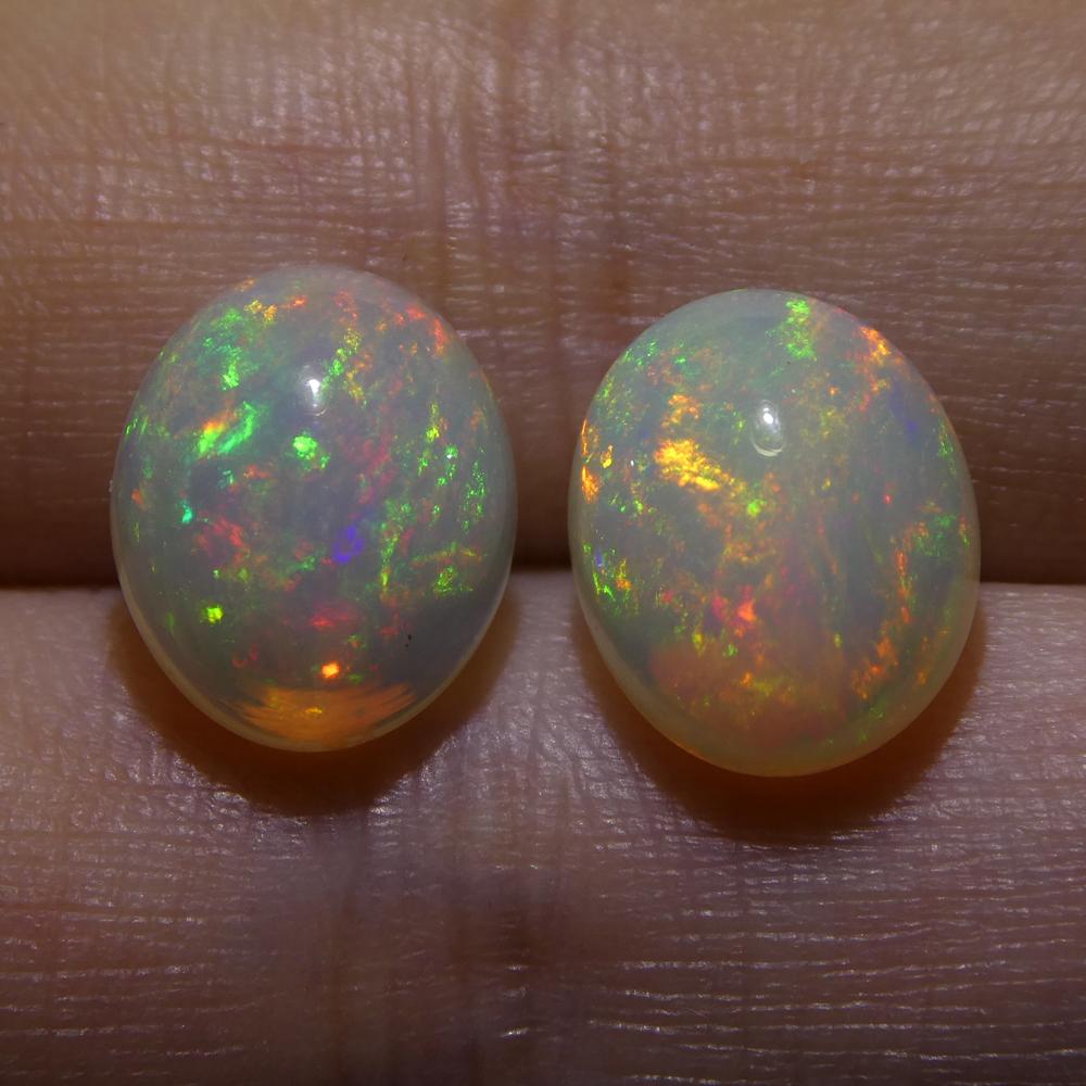 Description:

 

Gem Type: Opal
Number of Stones: 2
Weight: 4.9 cts
Measurements: 10.60x8.78x5.36 mm & 10.52x8.77x5.35 mm
Shape: Oval Cabochon
Cutting Style Crown: Cabochon
Cutting Style Pavilion:
Transparency: Translucent
Clarity: