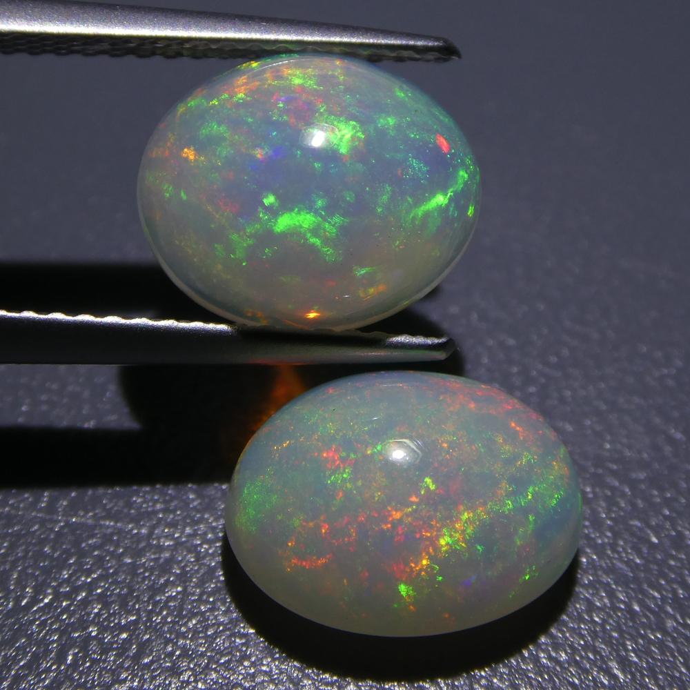 Oval Cut 4.90ct Oval Cabochon Crystal Opal Pair For Sale