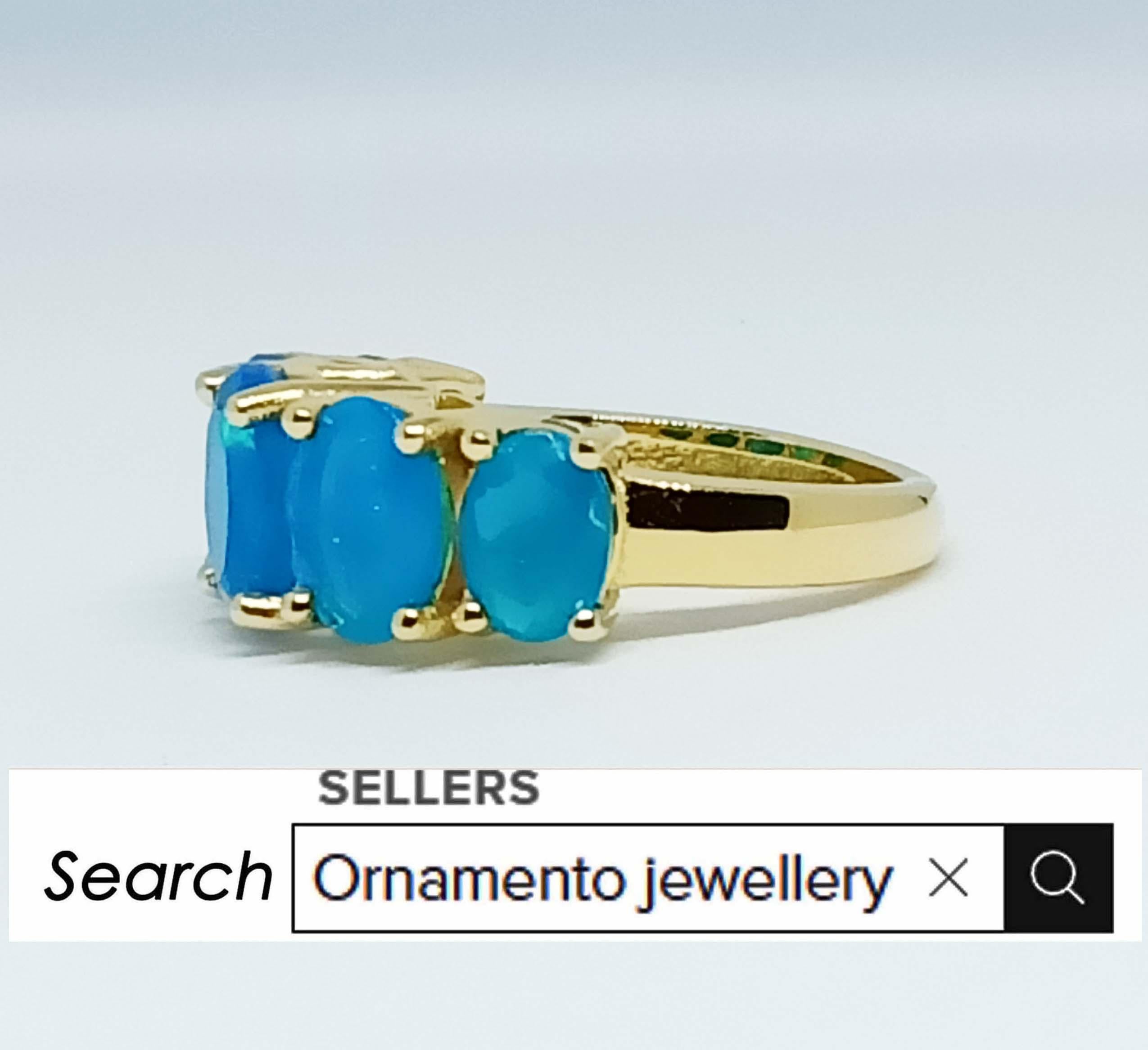 Contemporary 4.90cts Blue opal ring. Sterling Silver in 18K Gold Plated. For Sale