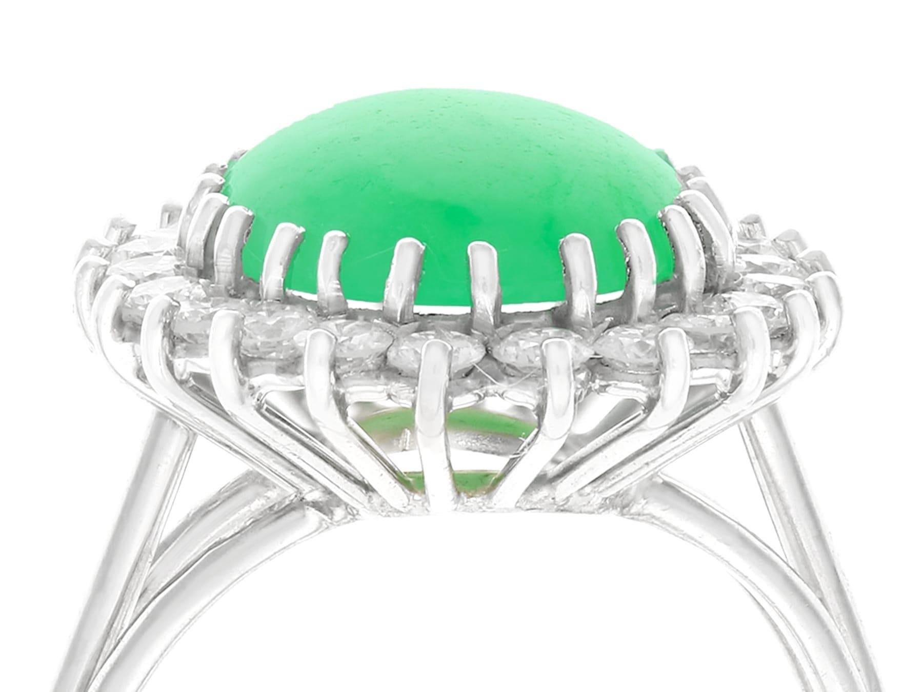 An impressive 4.91 carat jadeite and 1.00 carat diamond, 15 karat white gold cluster ring; part of our diverse gemstone jewelry and estate jewelry collections.

This fine and impressive vintage cabochon cut gemstone ring has been crafted in 15k
