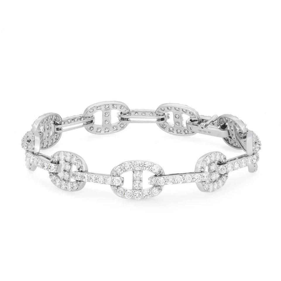 Crafted in 18K White Gold. 
Total Diamond Weight 4.91 Carat.  
Diamond quality: color G-H and clarity SI.
Bracelet length: 7 inches. Link size: 12mm x 9mm. 
Total weight: 14.22 Grams.

Product Disclaimer: Each of our jewelry pieces is uniquely