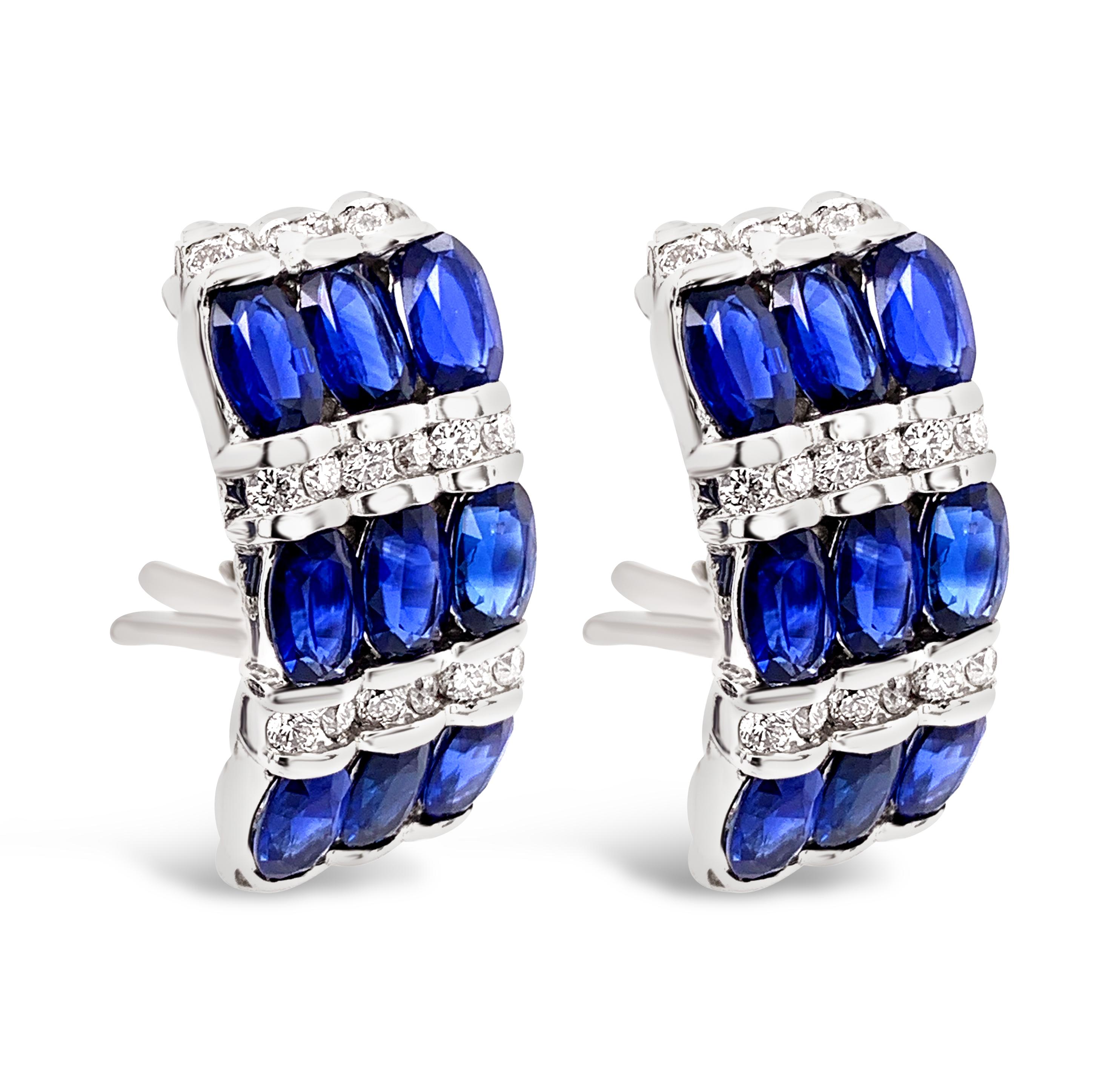4.91 Carat (total weight) Sapphire and Diamond Earrings in 18K White Gold.  Round brilliant diamonds weigh 0.72 Carat (total weight) with a color grade of H-I and clarity of VS-2-SI-1.  The earrings measure 21.0mm in length and 9.5mm wide and have
